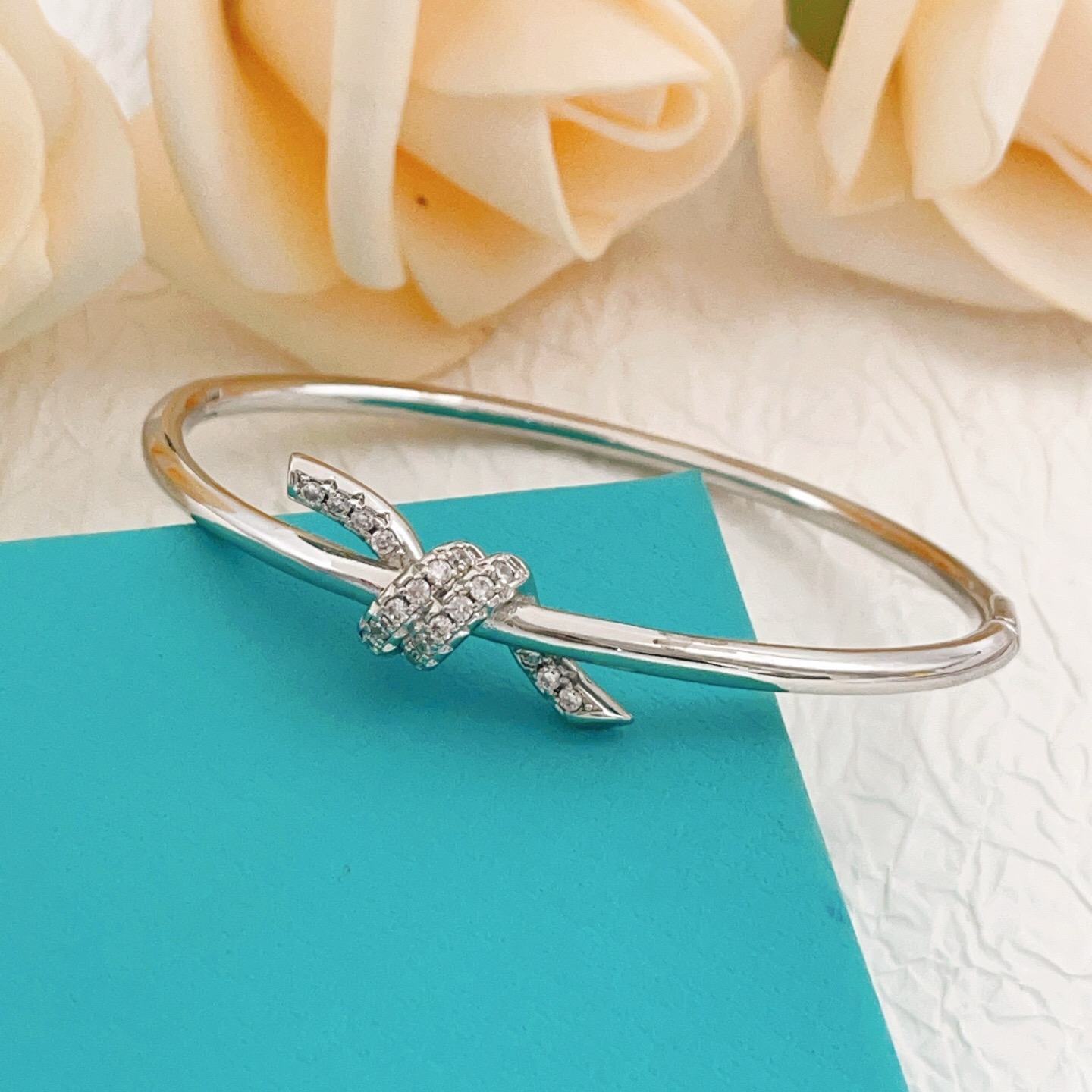 Tiffany Co Knot bracelet Silver-toned metal with clear diamond accents 17cm