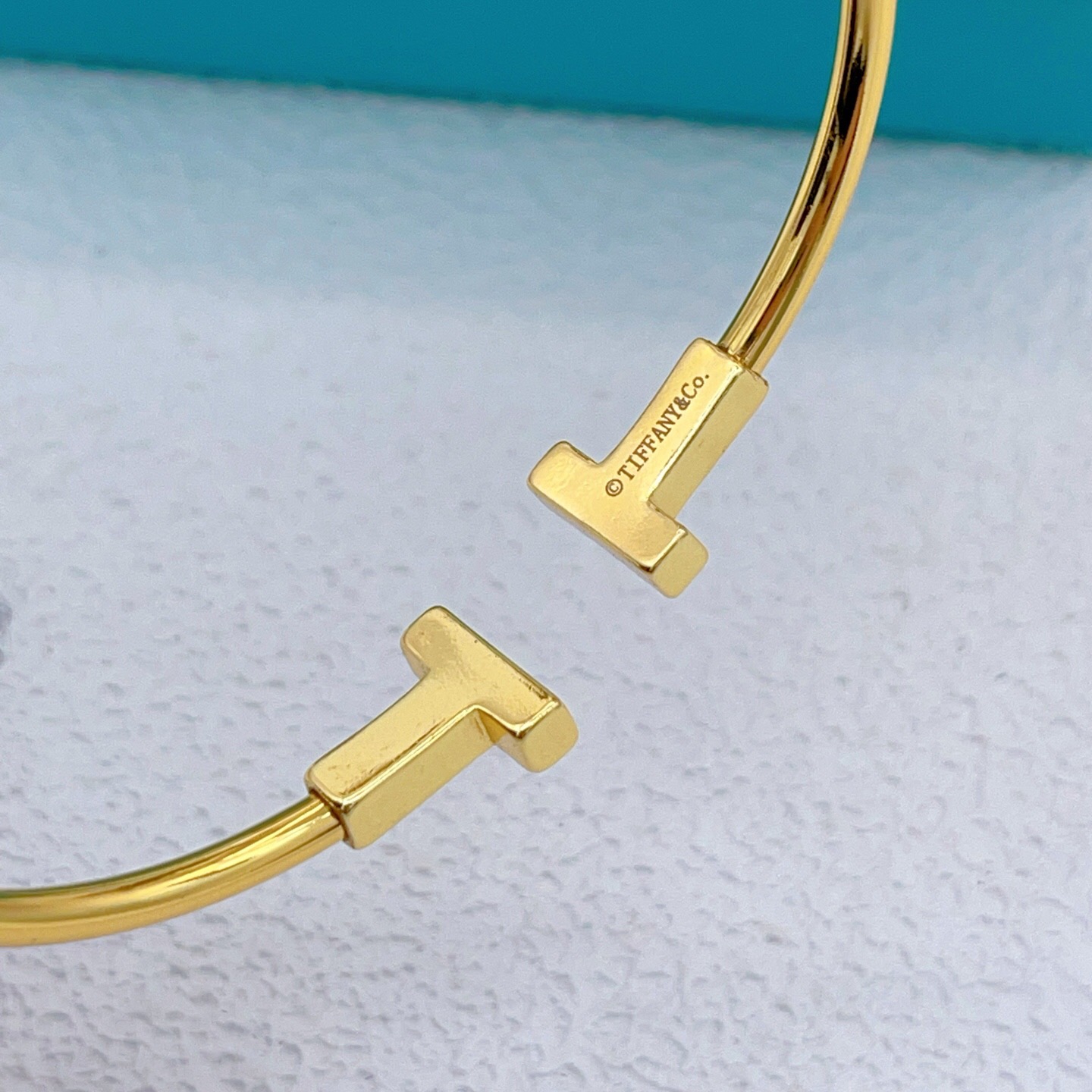 Tiffany T Wire bracelet Available in yellow gold with white mother-of-pearl inlay silver with white enamel inlay and rose gold with pink mother-of-pearl inlay 17cm inner circumference