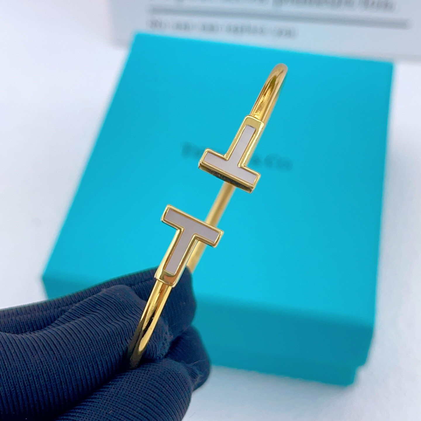 Tiffany T Wire bracelet Available in yellow gold with white mother-of-pearl inlay silver with white enamel inlay and rose gold with pink mother-of-pearl inlay 17cm inner circumference