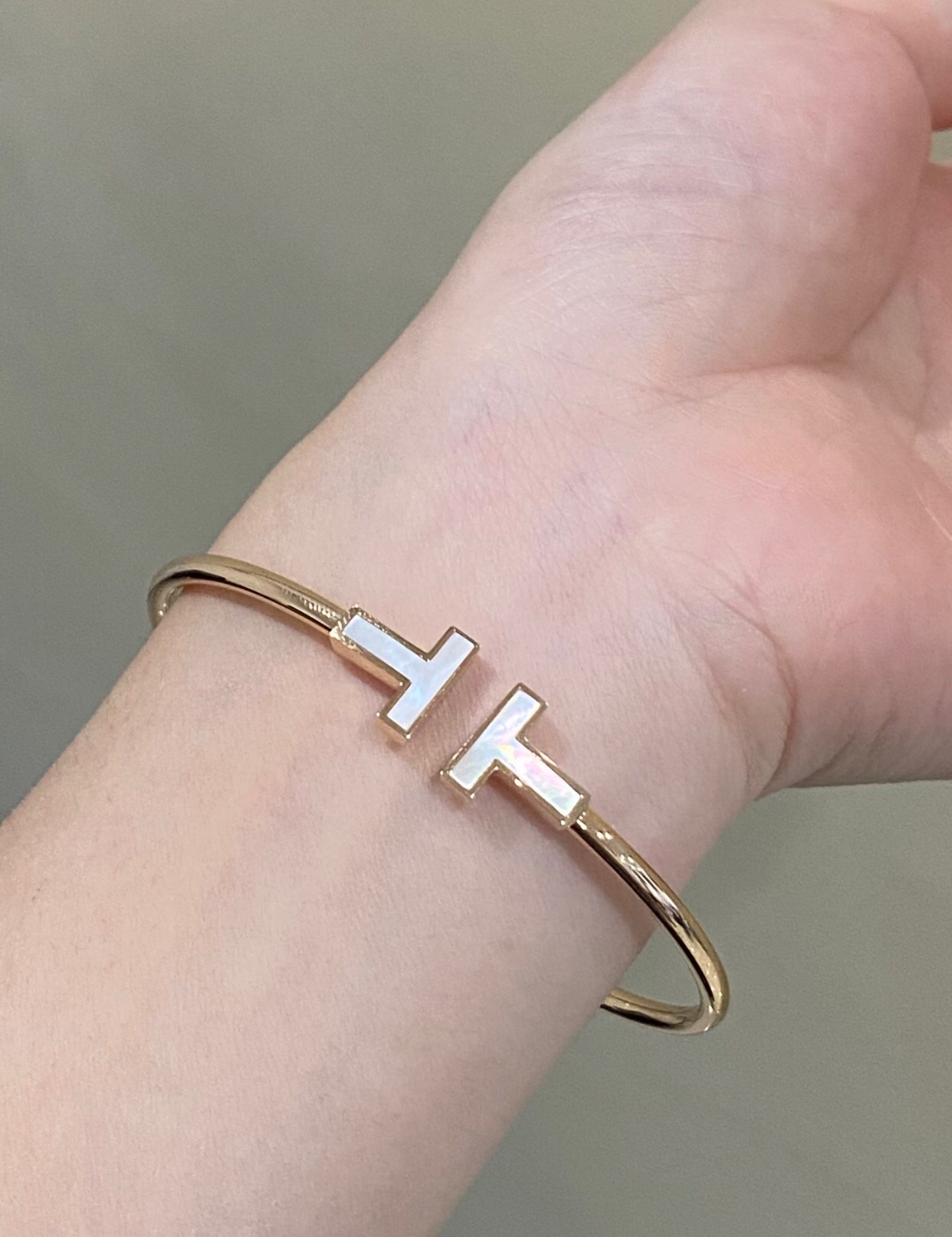 Tiffany T Wire bracelet Available in yellow gold with white mother-of-pearl inlay silver with white enamel inlay and rose gold with pink mother-of-pearl inlay 17cm inner circumference