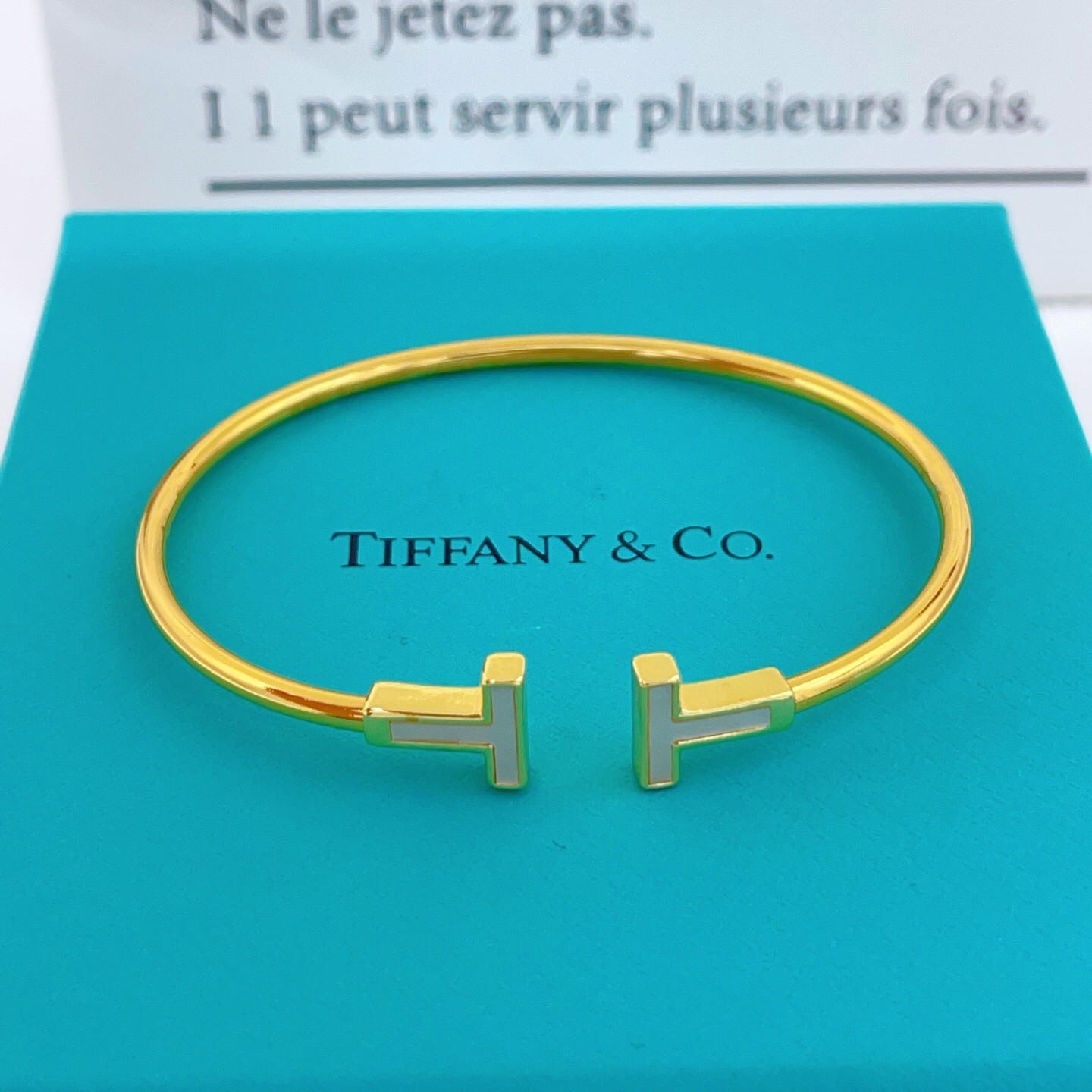 Tiffany T Wire bracelet Available in yellow gold with white mother-of-pearl inlay silver with white enamel inlay and rose gold with pink mother-of-pearl inlay 17cm inner circumference