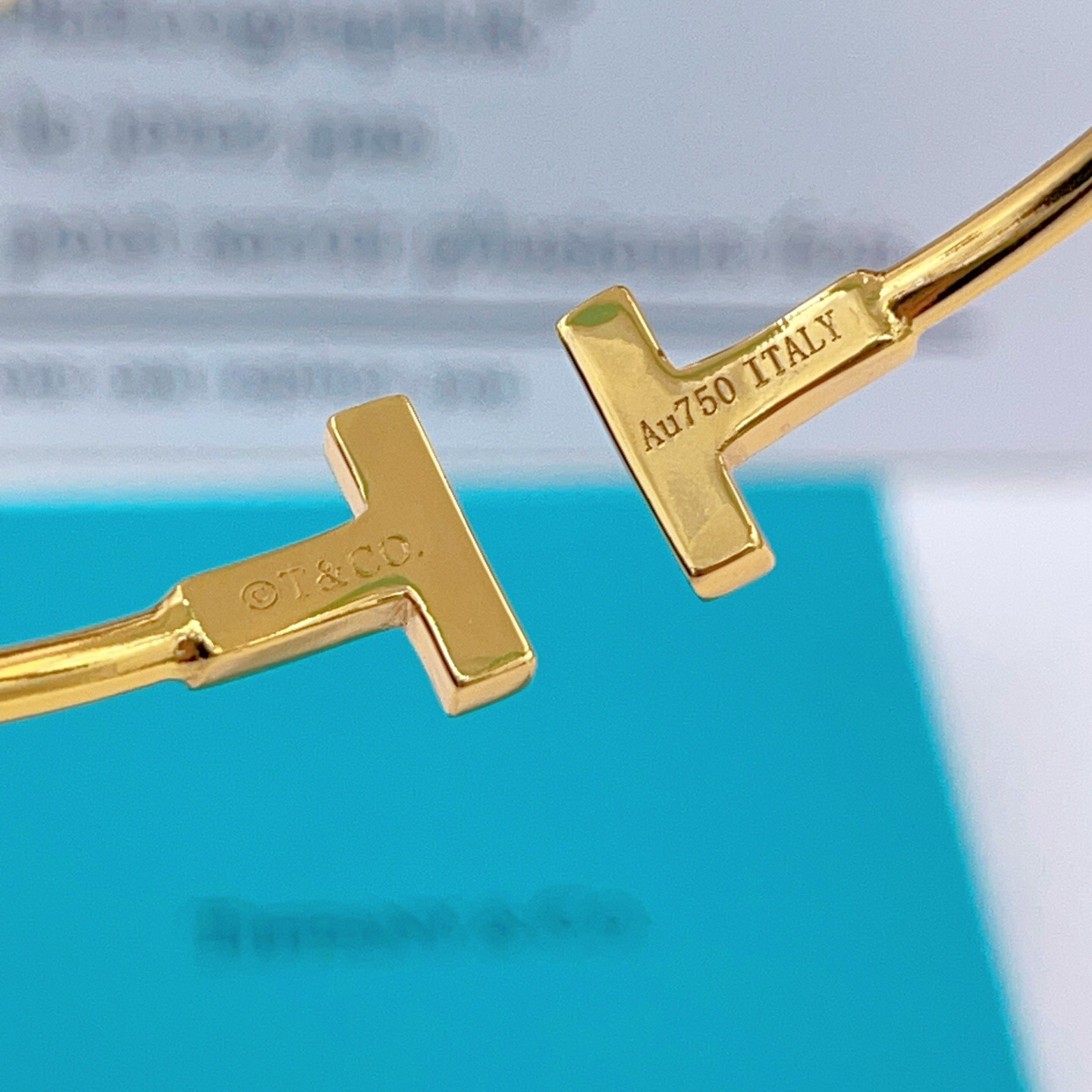 Tiffany Co T Wire bracelet gold metal with clear diamond accents 17cm inner circumference