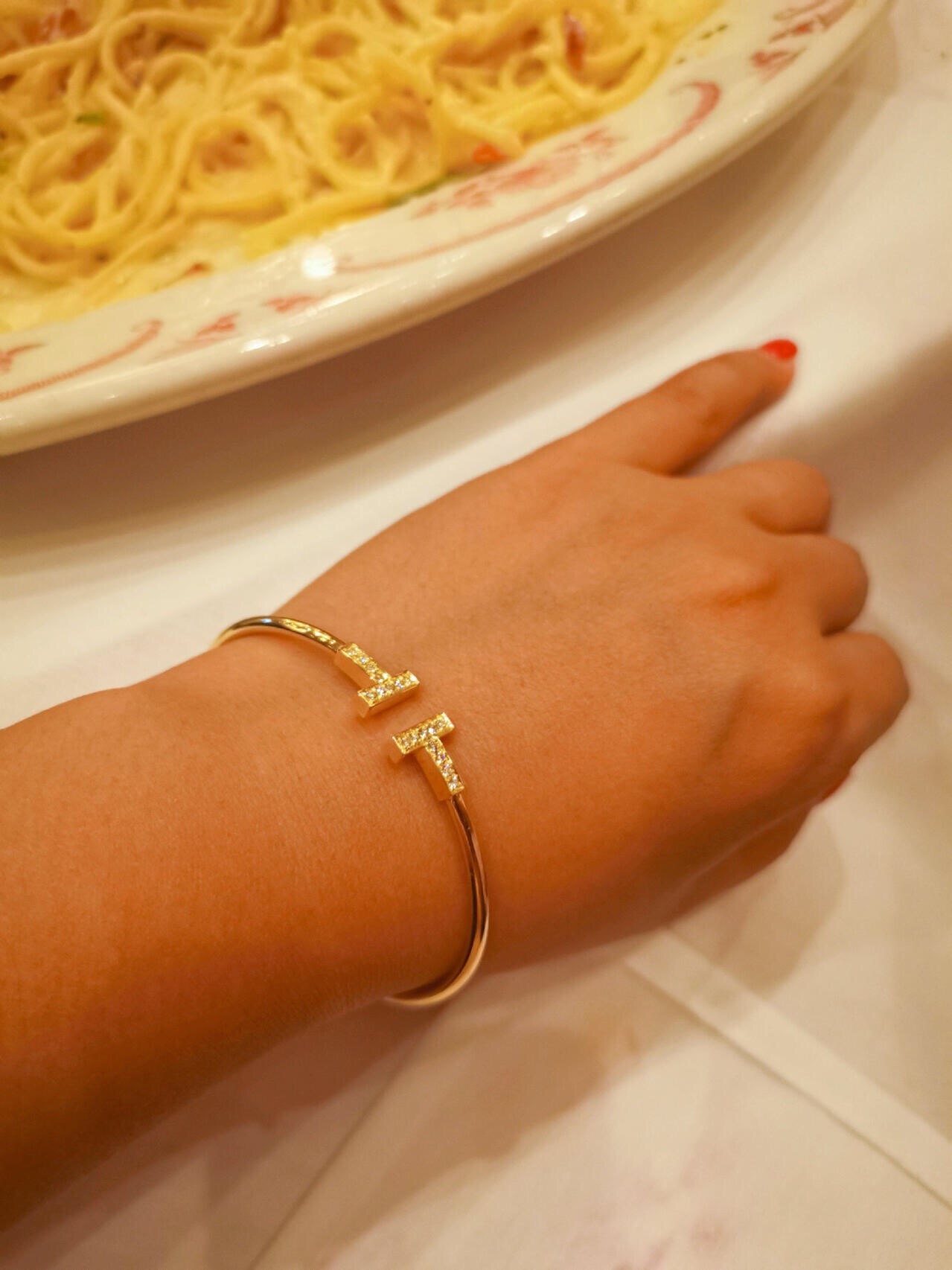 Tiffany Co T Wire bracelet gold metal with clear diamond accents 17cm inner circumference