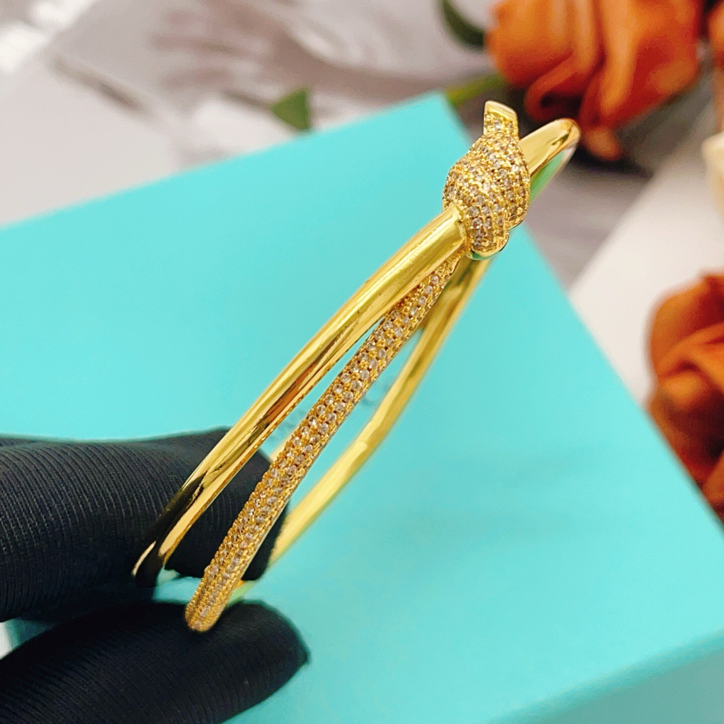 Tiffany Co Knot bracelet yellow gold metal with clear diamond pave accents 17cm inner circumference