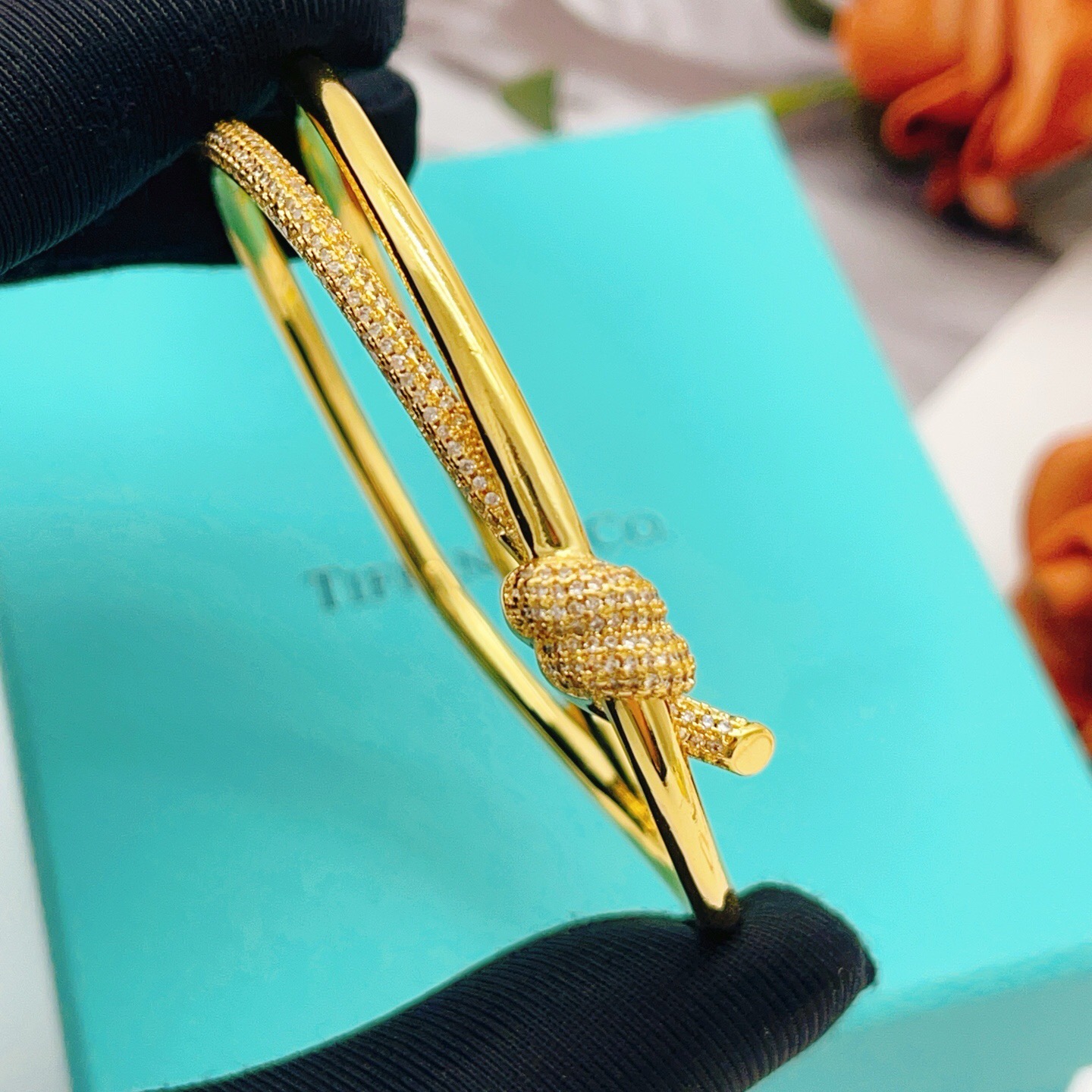 Tiffany Co Knot bracelet yellow gold metal with clear diamond pave accents 17cm inner circumference