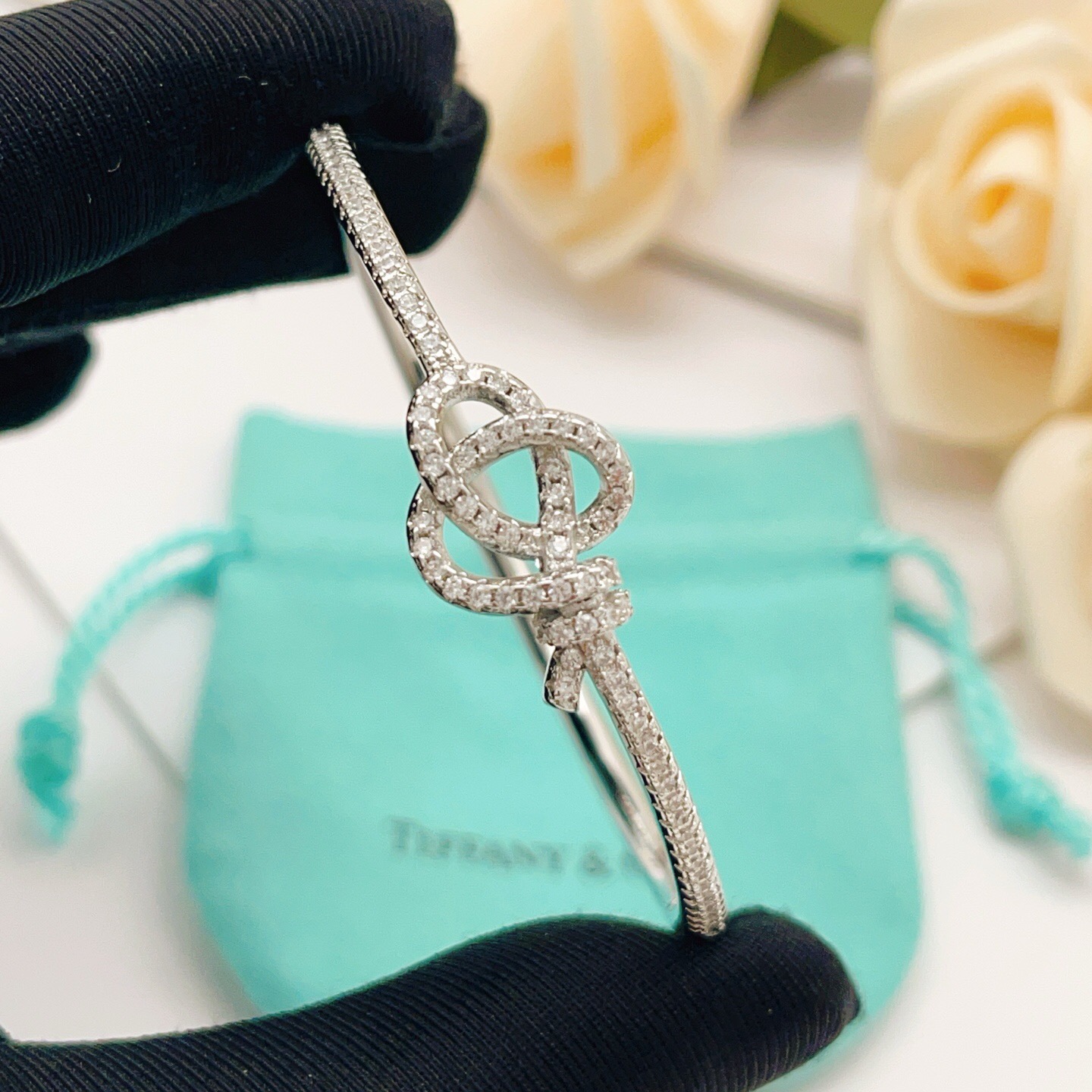 Tiffany Co Knot bracelet silver-toned metal with clear diamond-like accent stones 17cm inner circumference