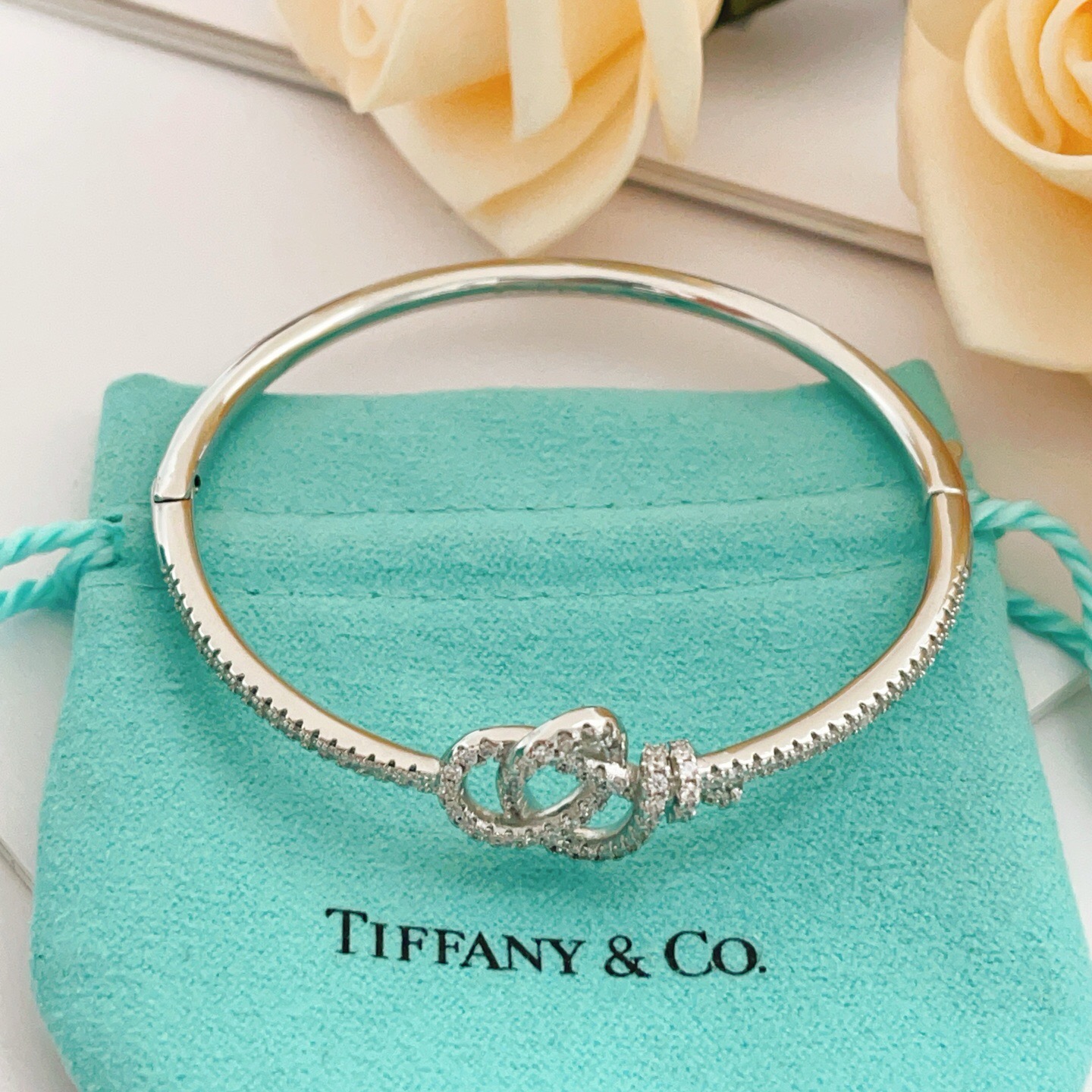 Tiffany Co Knot bracelet silver-toned metal with clear diamond-like accent stones 17cm inner circumference