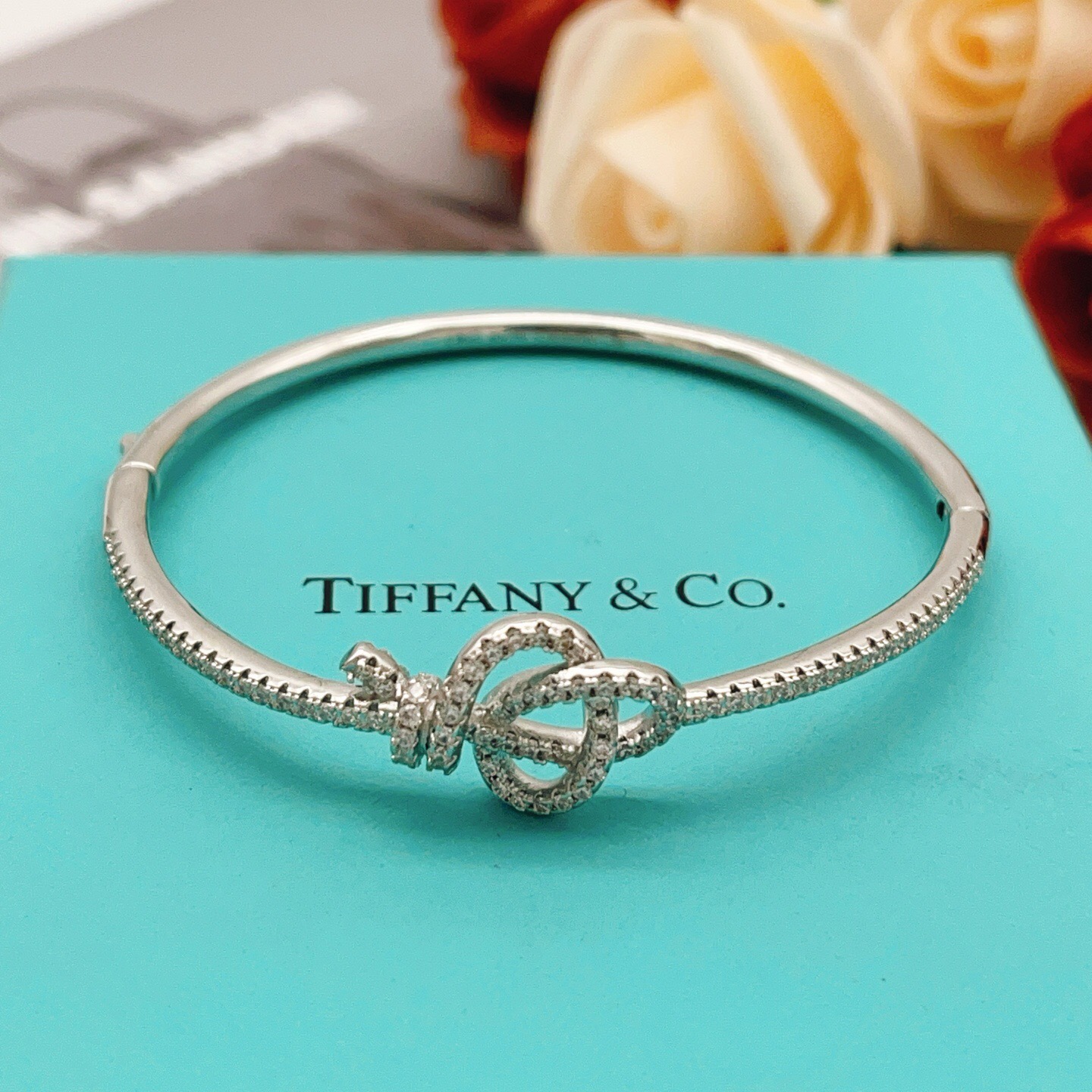 Tiffany Co Knot bracelet silver-toned metal with clear diamond-like accent stones 17cm inner circumference
