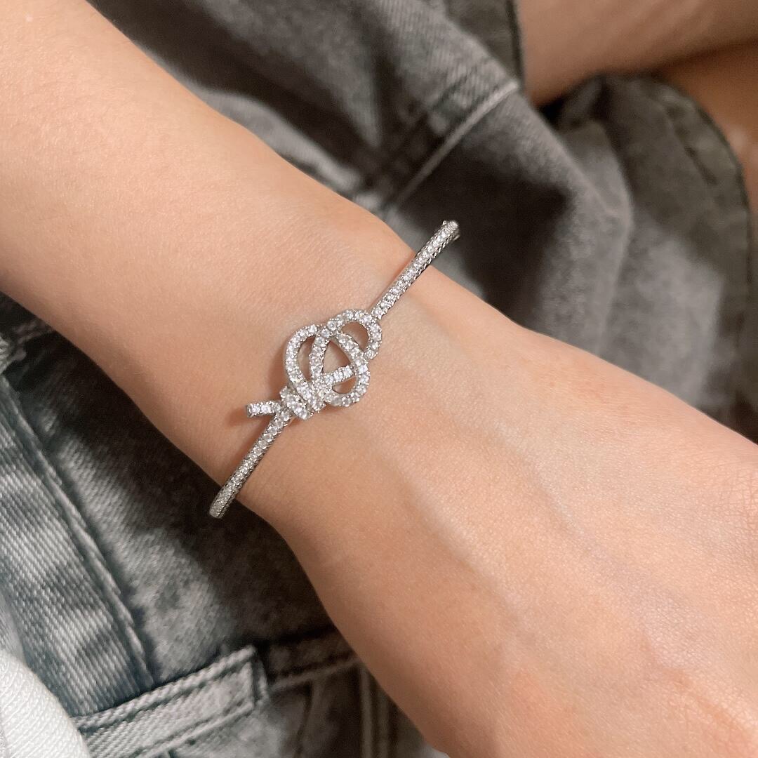 Tiffany Co Knot bracelet silver-toned metal with clear diamond-like accent stones 17cm inner circumference