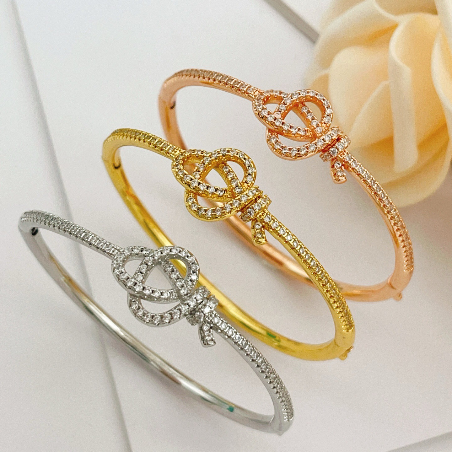 Tiffany Co Knot bracelet Rose gold metal with clear diamond accent stones 17cm inner circumference