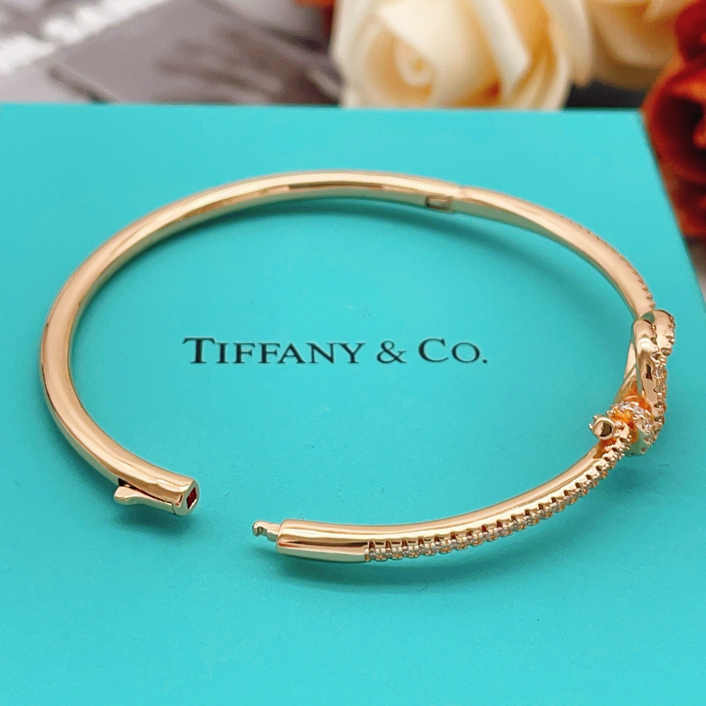 Tiffany Co Knot bracelet Rose gold metal with clear diamond accent stones 17cm inner circumference