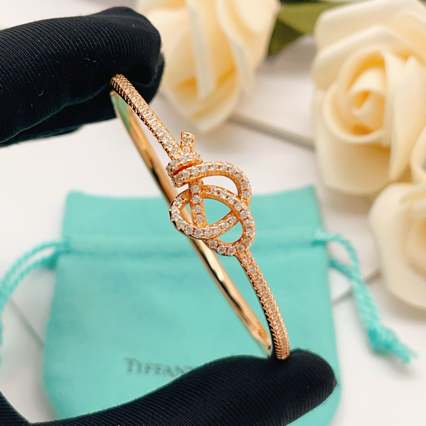 Tiffany Co Knot bracelet Rose gold metal with clear diamond accent stones 17cm inner circumference