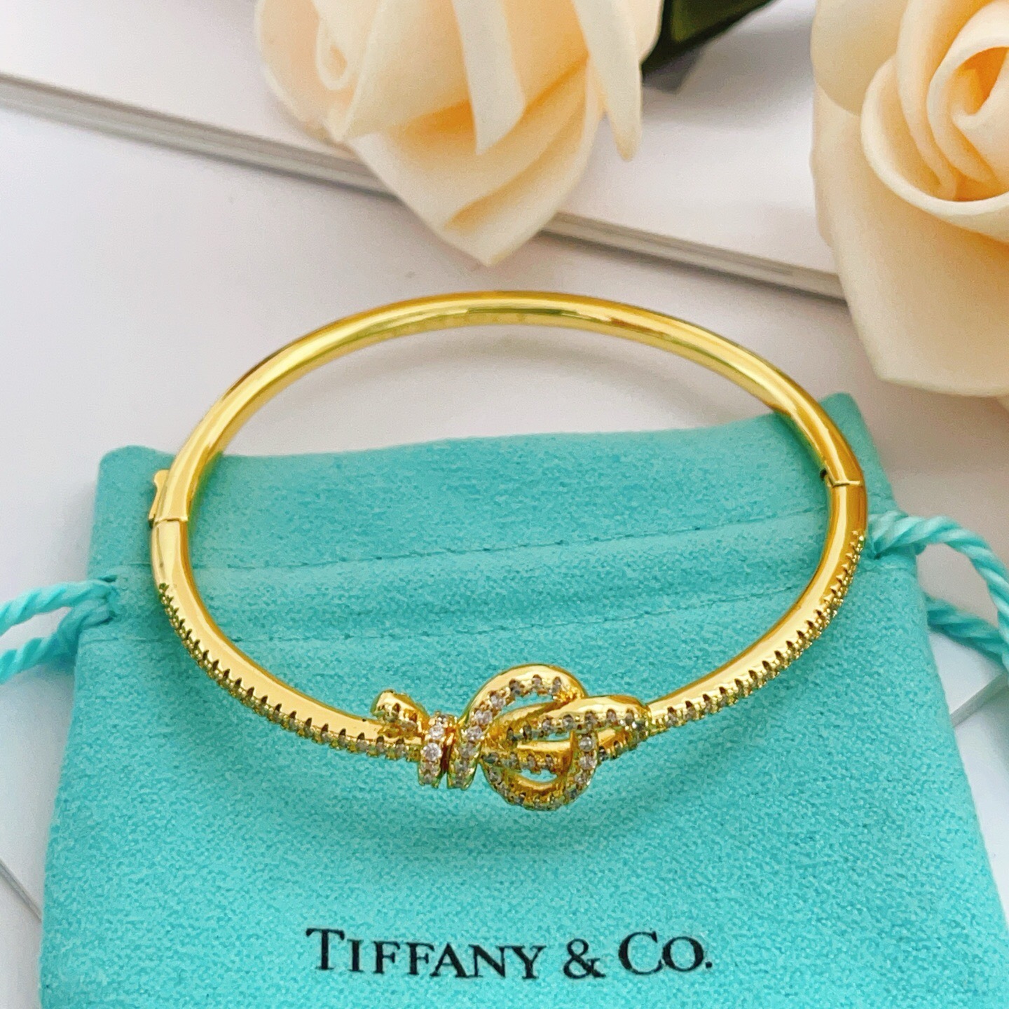 Tiffany Co Knot bracelet yellow gold with clear diamond accents 17cm inner circumference