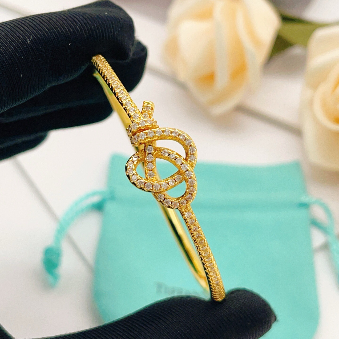 Tiffany Co Knot bracelet yellow gold with clear diamond accents 17cm inner circumference