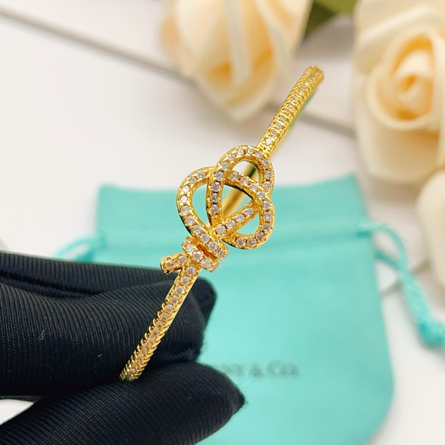 Tiffany Co Knot bracelet yellow gold with clear diamond accents 17cm inner circumference