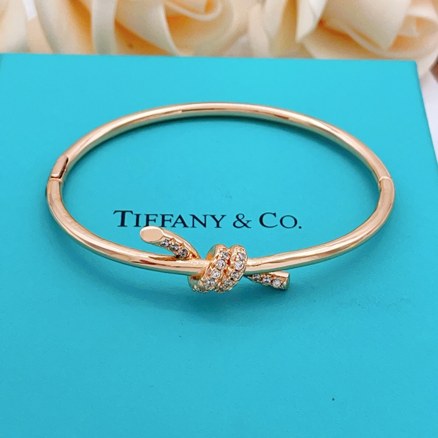 Tiffany Co Knot bracelet 18k rose gold with clear diamond accents 17cm inner circumference