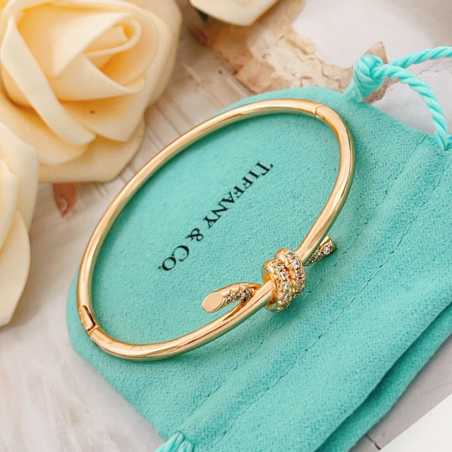 Tiffany Co Knot bracelet 18k rose gold with clear diamond accents 17cm inner circumference
