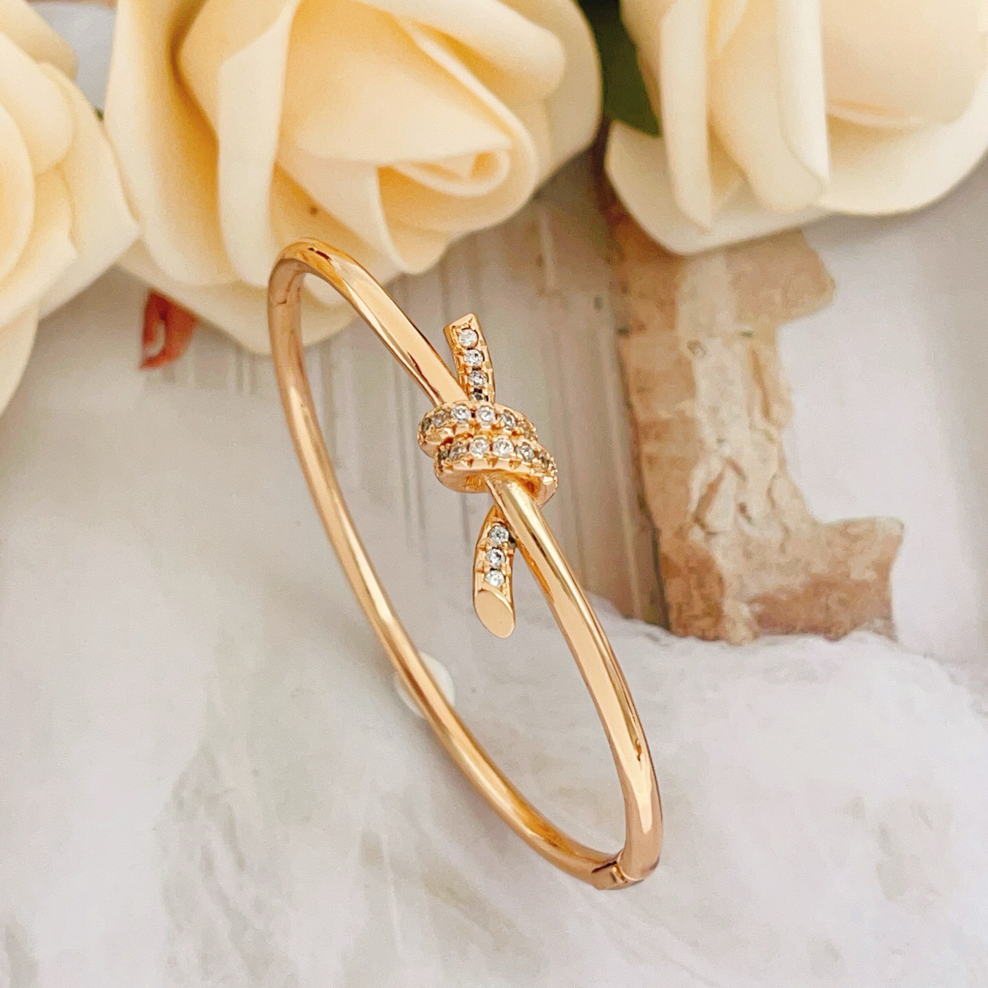 Tiffany Co Knot bracelet 18k rose gold with clear diamond accents 17cm inner circumference