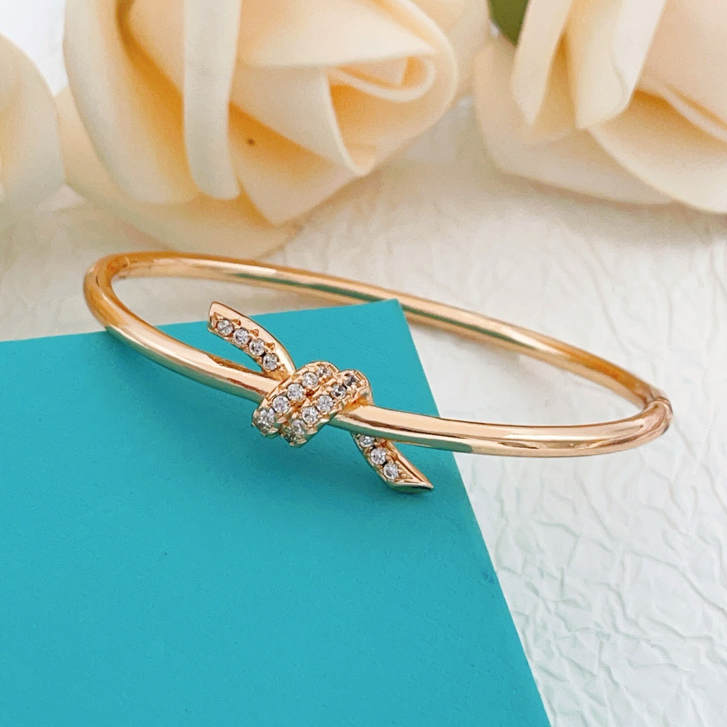 Tiffany Co Knot bracelet 18k rose gold with clear diamond accents 17cm inner circumference