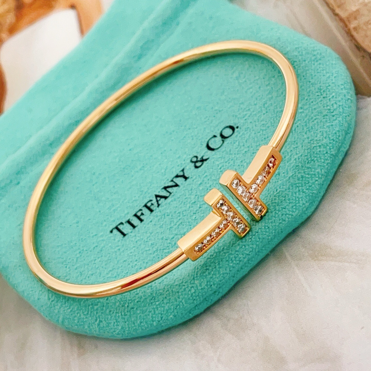 Tiffany T Wire bracelet 18k rose gold with clear diamond accents 18k yellow gold with clear diamond accents sterling silver with clear diamond accents 17cm inner circumference