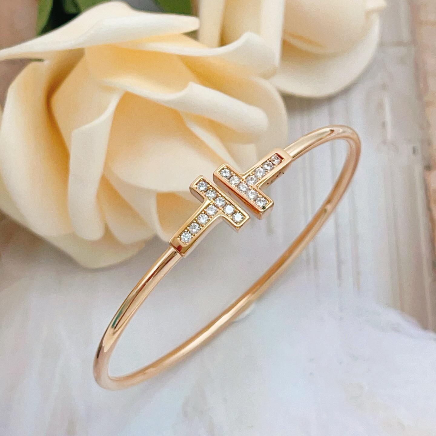 Tiffany T Wire bracelet 18k rose gold with clear diamond accents 18k yellow gold with clear diamond accents sterling silver with clear diamond accents 17cm inner circumference