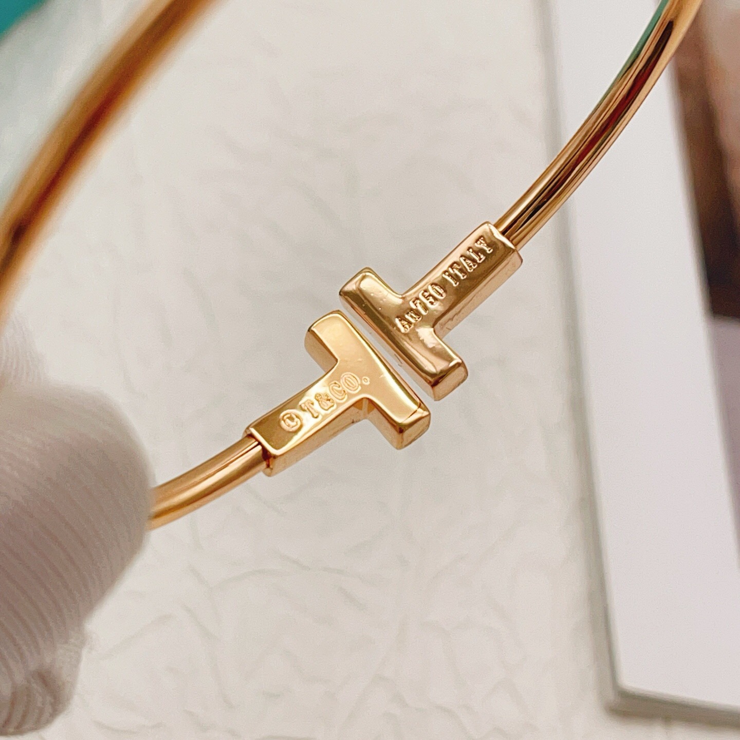 Tiffany T Wire bracelet 18k rose gold with clear diamond accents 18k yellow gold with clear diamond accents sterling silver with clear diamond accents 17cm inner circumference