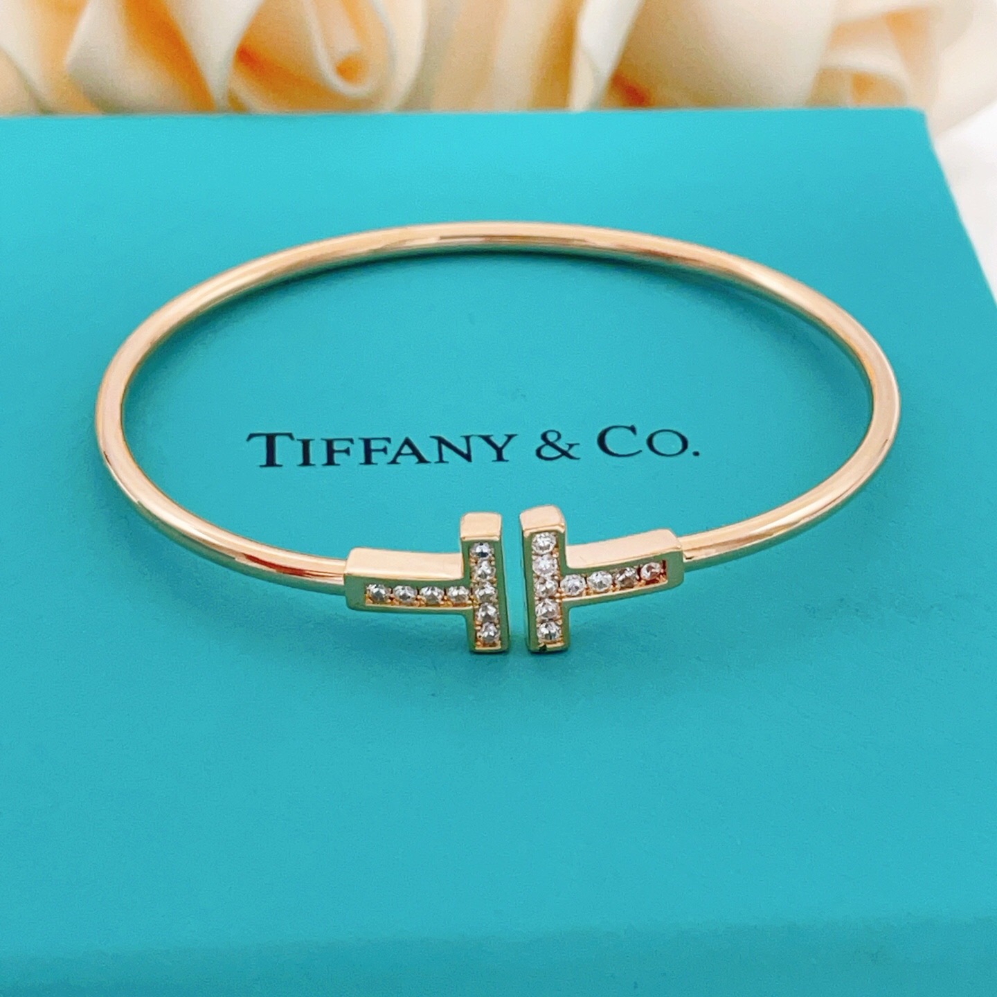 Tiffany T Wire bracelet 18k rose gold with clear diamond accents 18k yellow gold with clear diamond accents sterling silver with clear diamond accents 17cm inner circumference