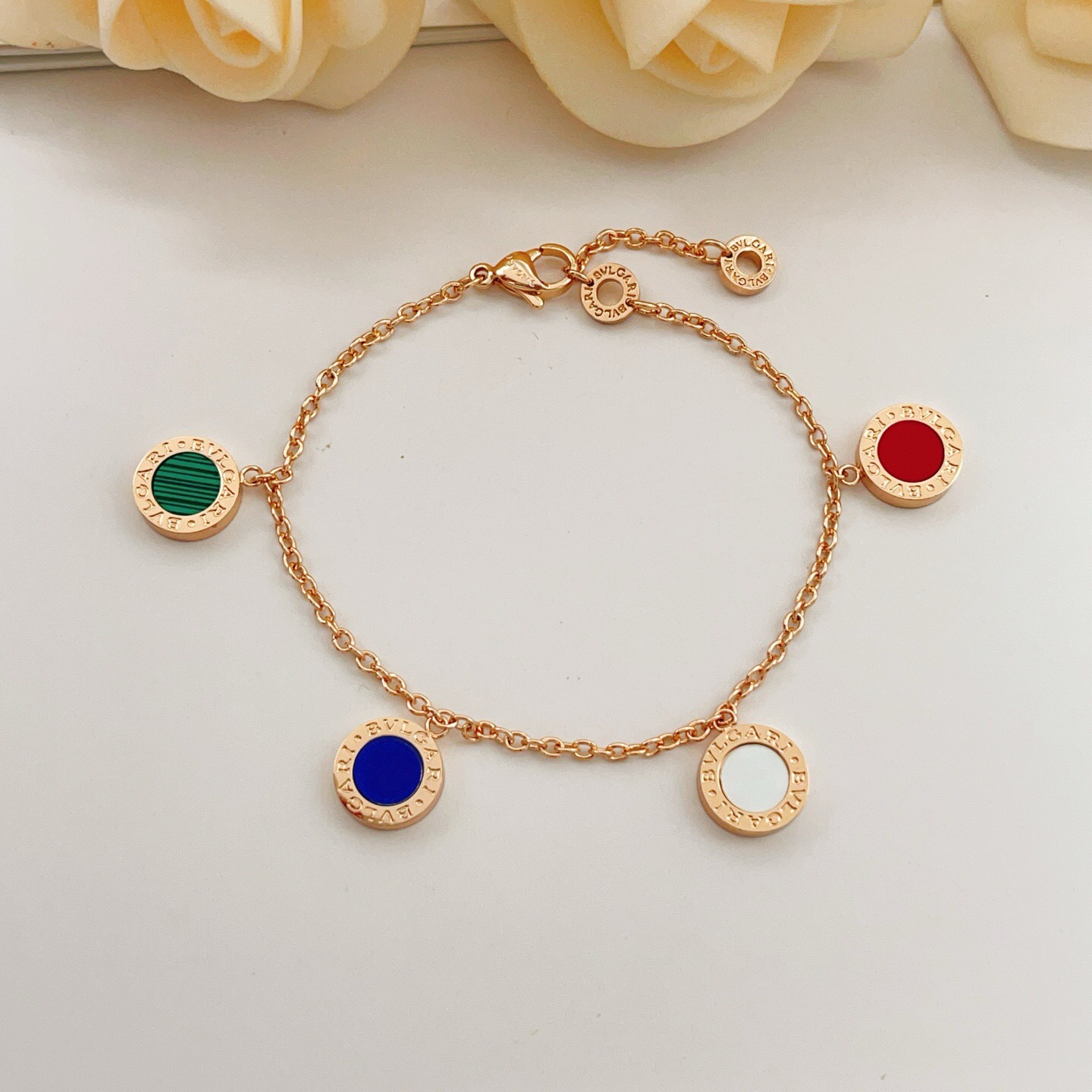 Bvlgari Bvlgari bracelet rose gold metal with red green malachite blue and white mother-of-pearl stone accents 18cm