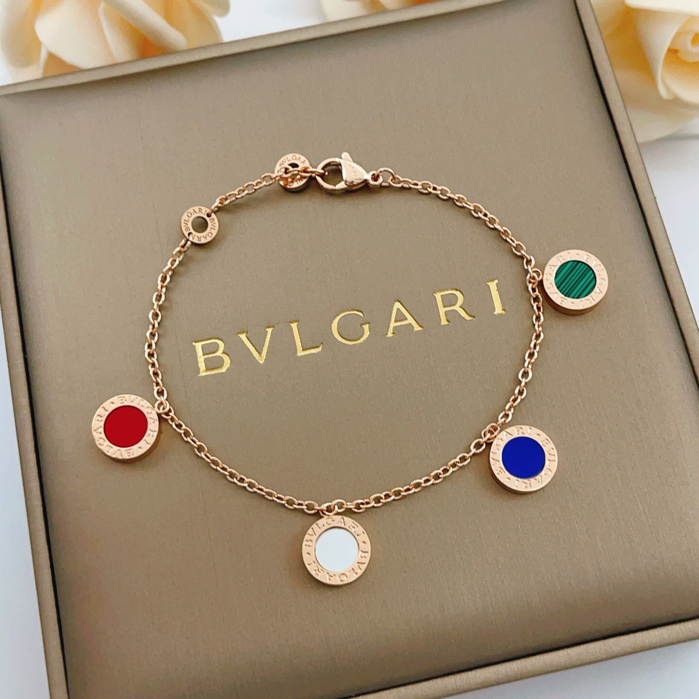 Bvlgari Bvlgari bracelet rose gold metal with red green malachite blue and white mother-of-pearl stone accents 18cm