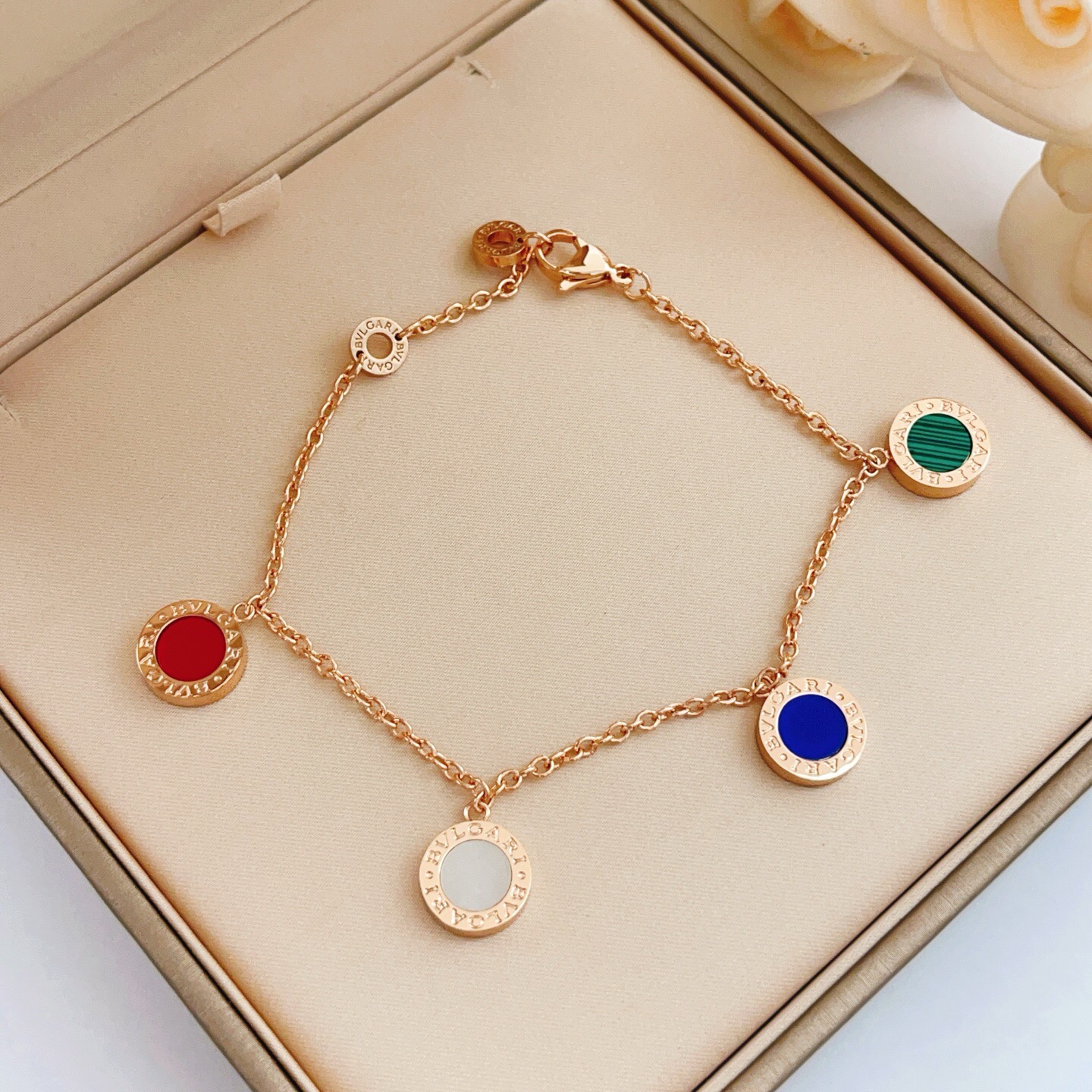 Bvlgari Bvlgari bracelet rose gold metal with red green malachite blue and white mother-of-pearl stone accents 18cm