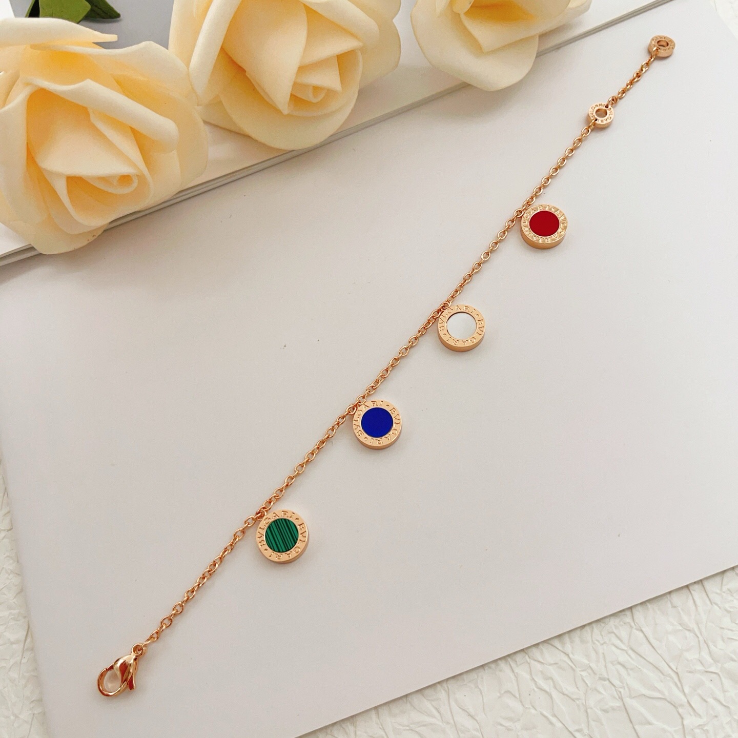Bvlgari Bvlgari bracelet rose gold metal with red green malachite blue and white mother-of-pearl stone accents 18cm