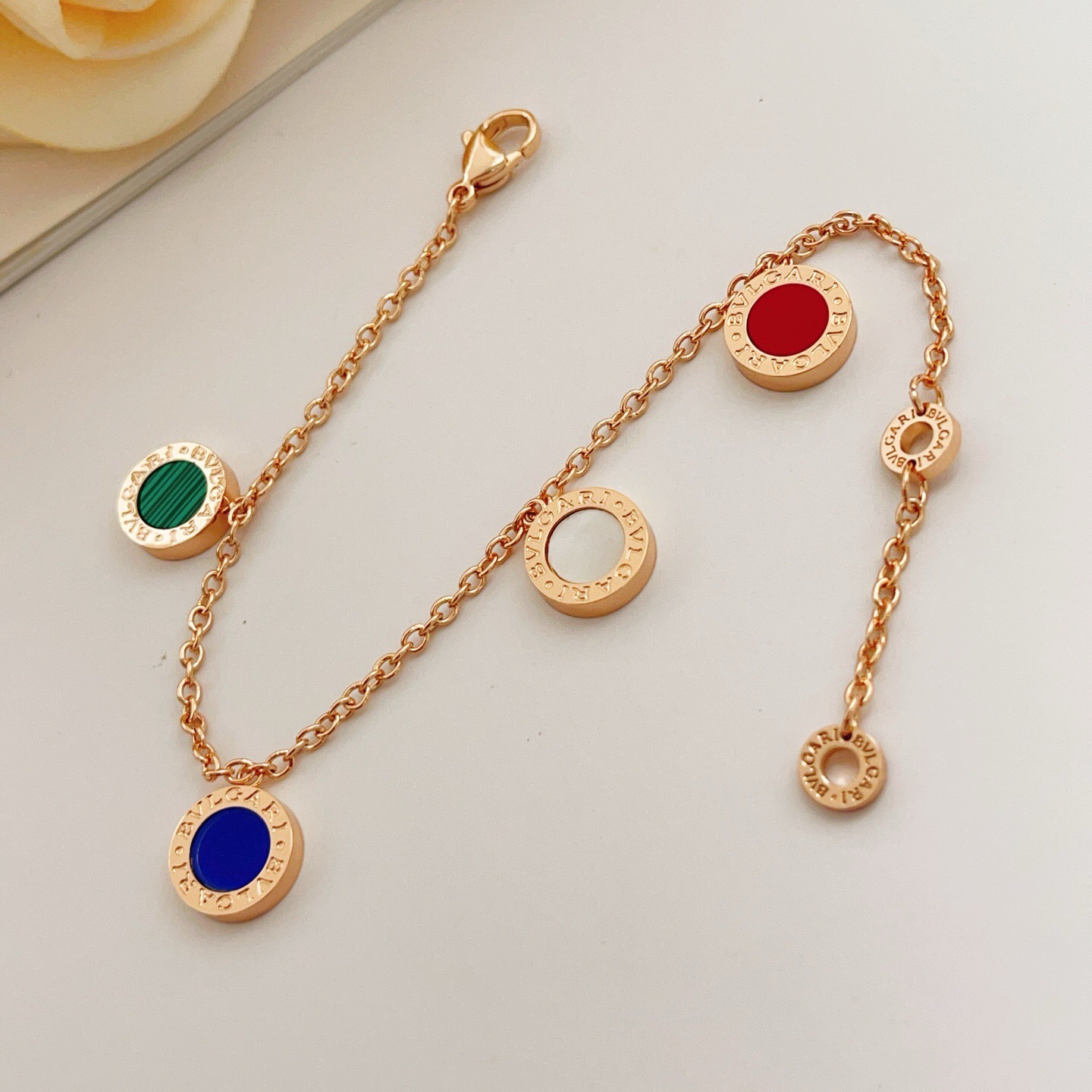 Bvlgari Bvlgari bracelet rose gold metal with red green malachite blue and white mother-of-pearl stone accents 18cm
