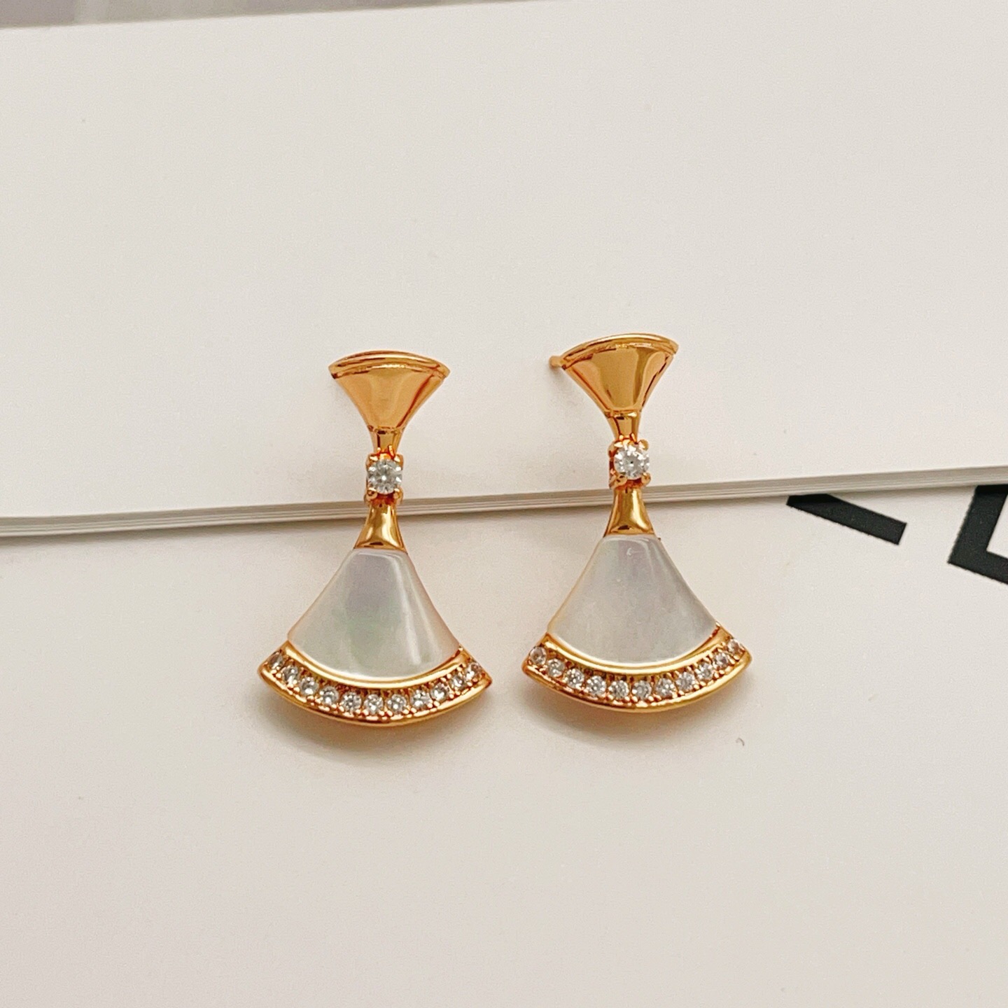 Bvlgari Divas Dream earrings rose gold metal with white mother-of-pearl and clear diamond accents 2 2cm drop length