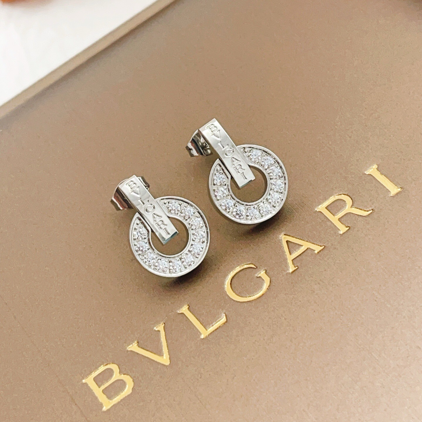 Bvlgari Bvlgari Bvlgari earrings silver-toned white gold with clear diamond accents 1 5cm diameter