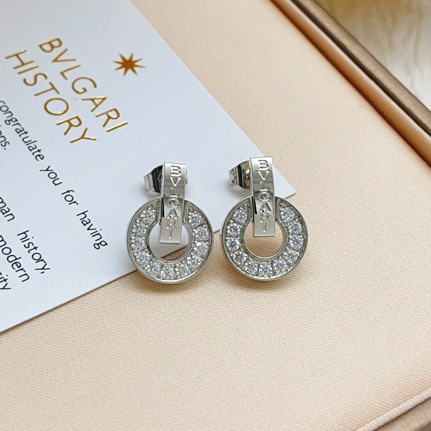 Bvlgari Bvlgari Bvlgari earrings silver-toned white gold with clear diamond accents 1 5cm diameter