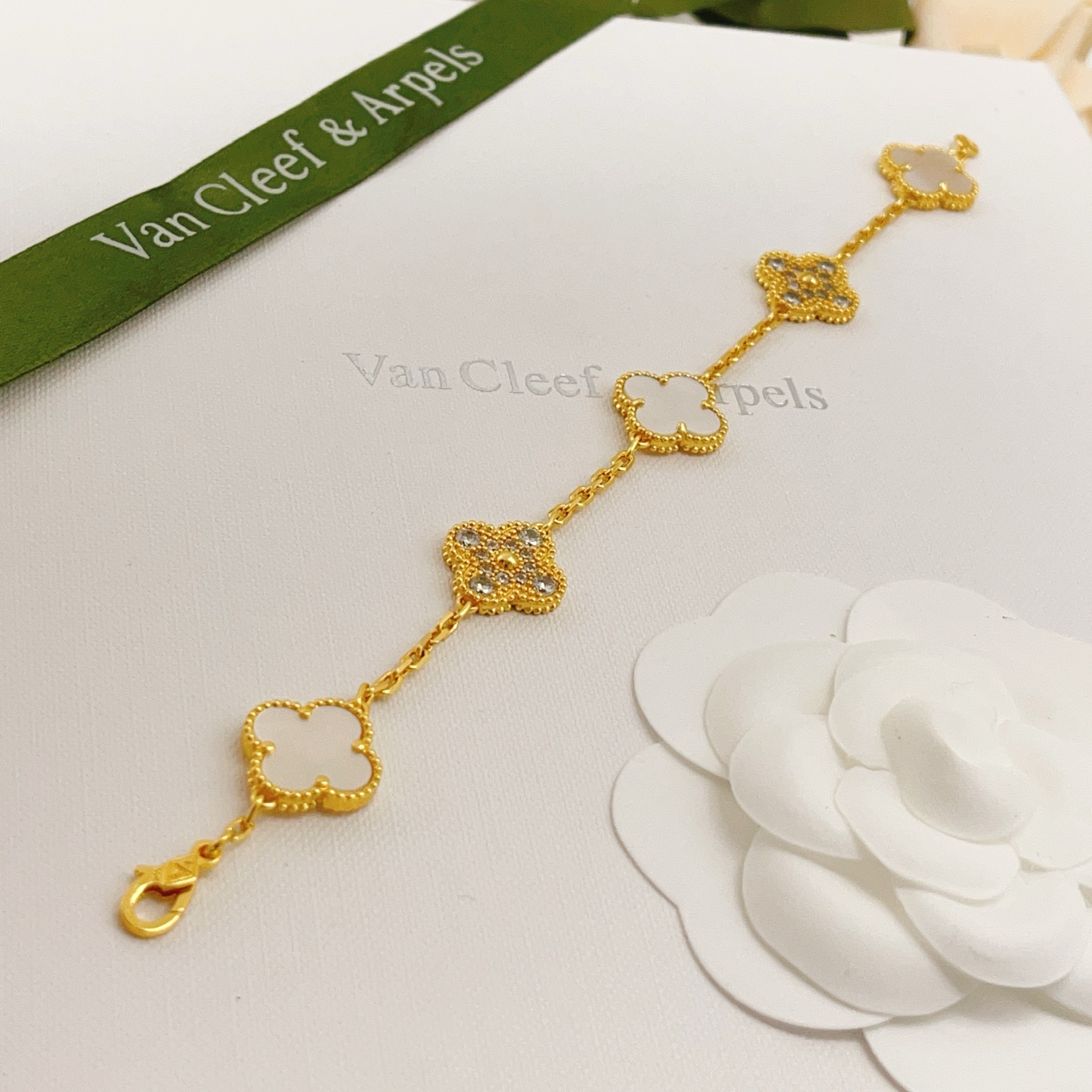 Van Cleef Arpels Vintage Alhambra bracelet Yellow gold with white mother-of-pearl and clear diamond accents 18cm