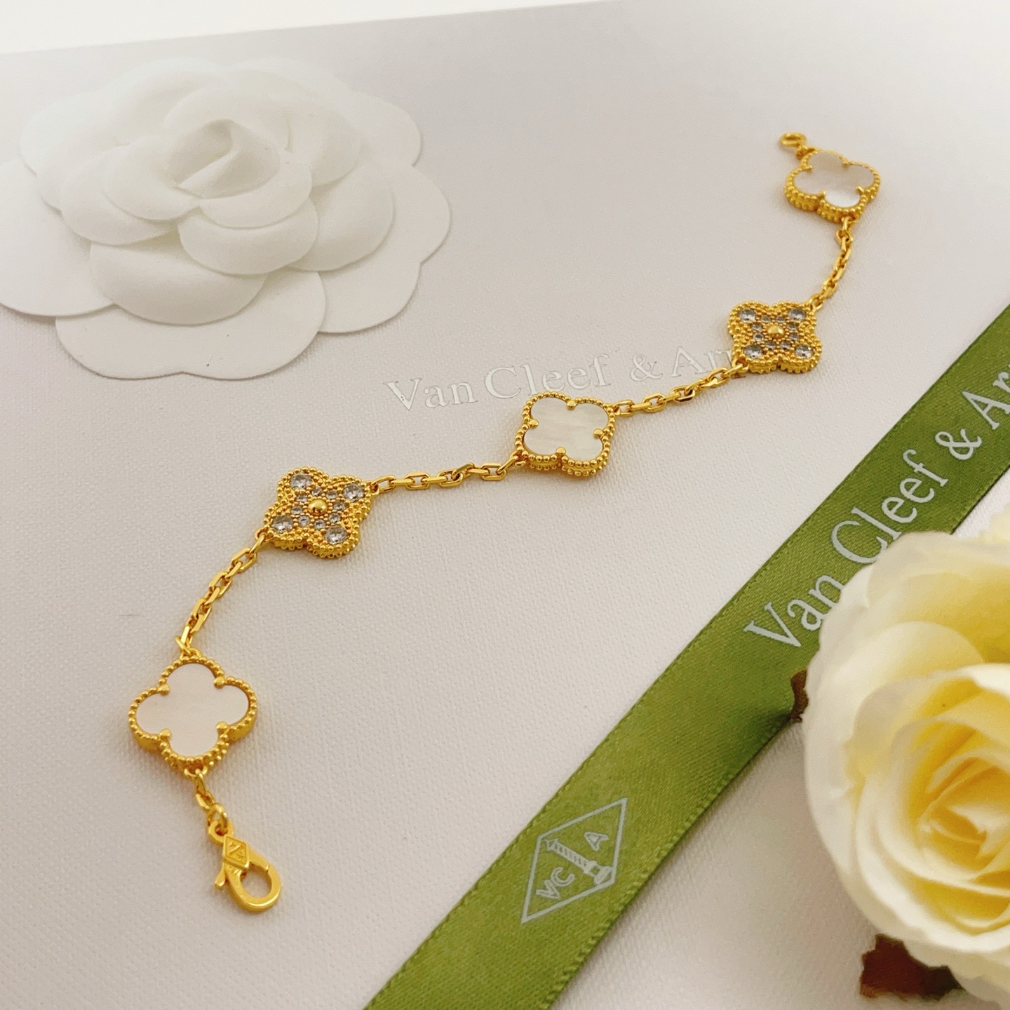 Van Cleef Arpels Vintage Alhambra bracelet Yellow gold with white mother-of-pearl and clear diamond accents 18cm