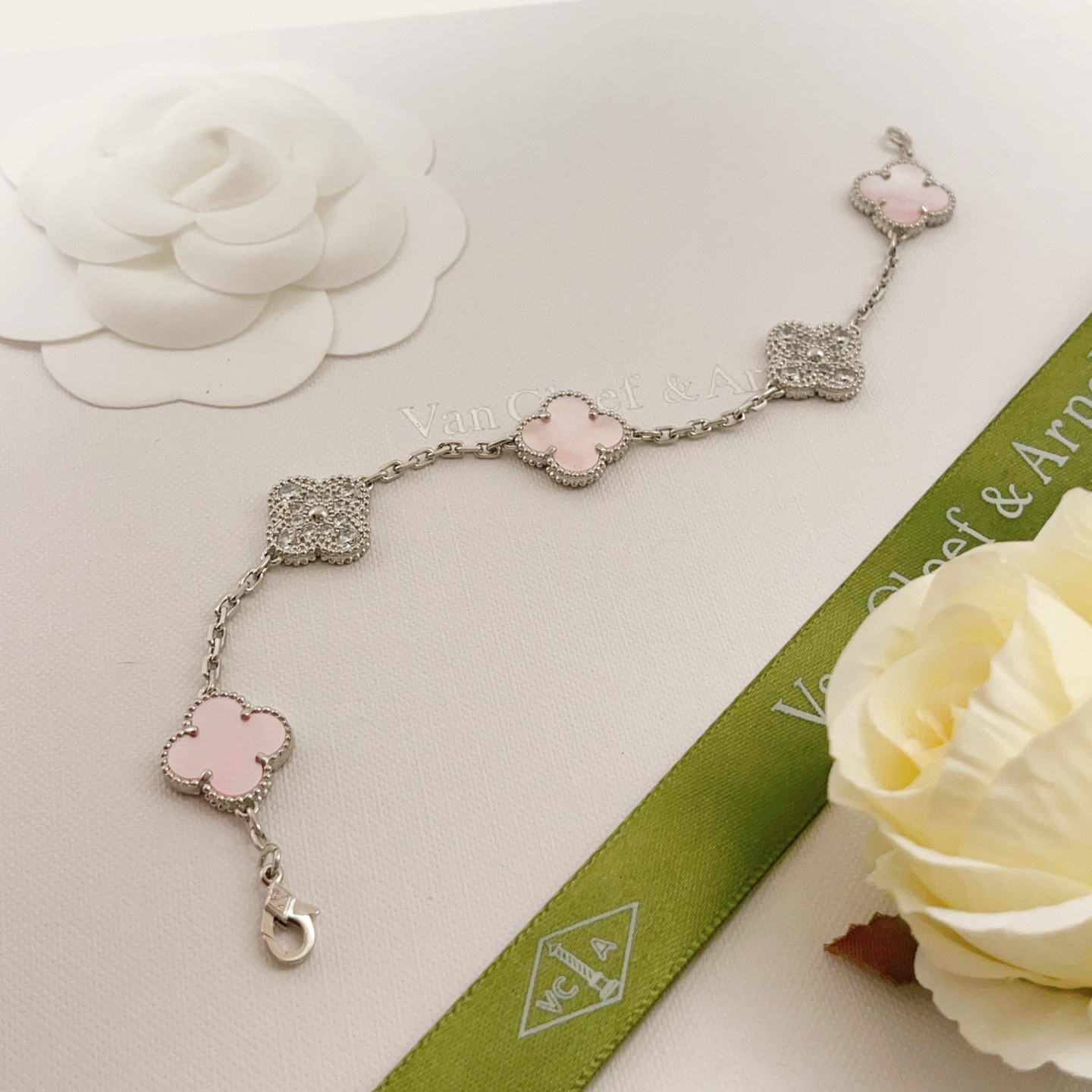 Van Cleef Arpels Alhambra bracelet Silver-toned white gold metal with pink mother-of-pearl white mother-of-pearl and clear diamond accents 17cm