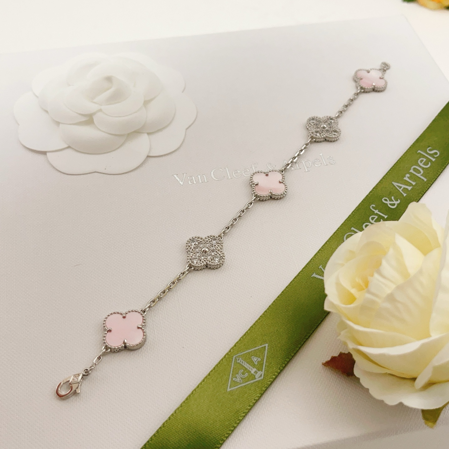 Van Cleef Arpels Alhambra bracelet Silver-toned white gold metal with pink mother-of-pearl white mother-of-pearl and clear diamond accents 17cm
