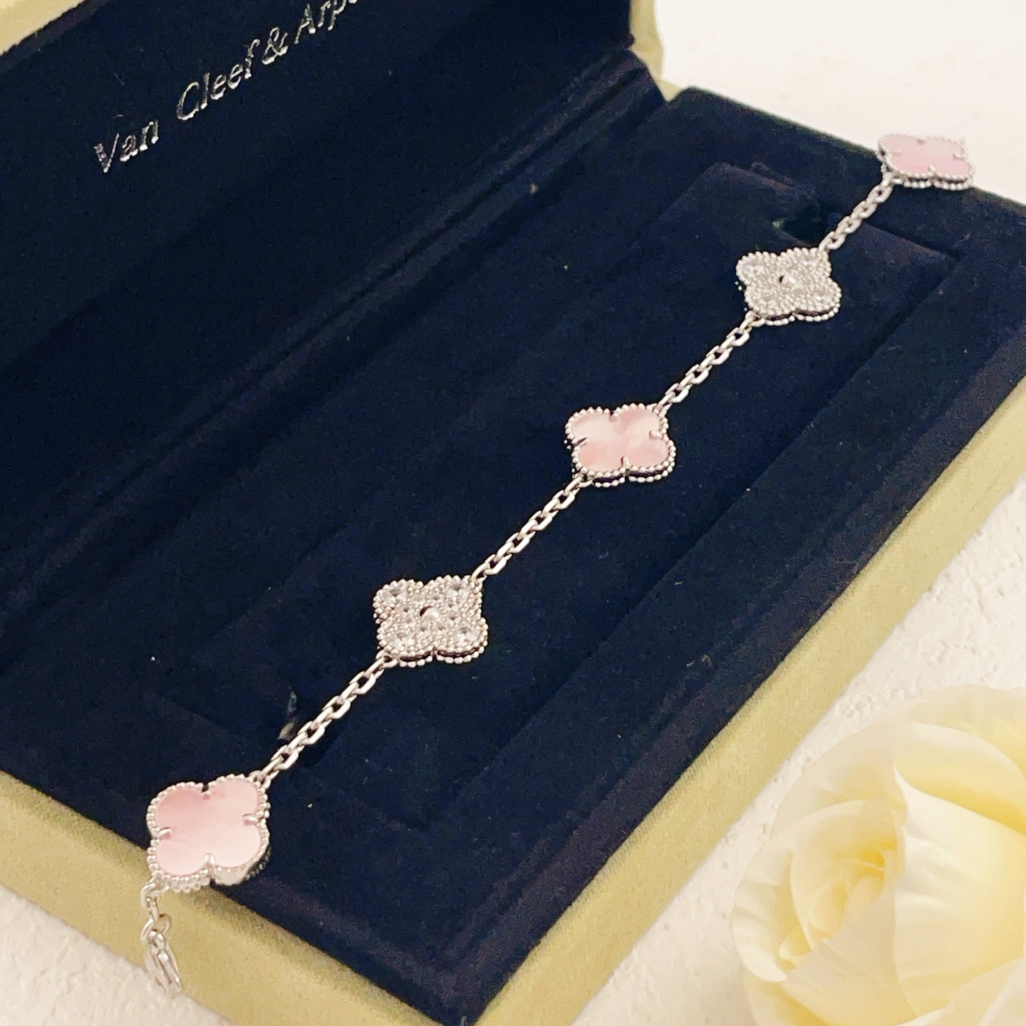 Van Cleef Arpels Alhambra bracelet Silver-toned white gold metal with pink mother-of-pearl white mother-of-pearl and clear diamond accents 17cm