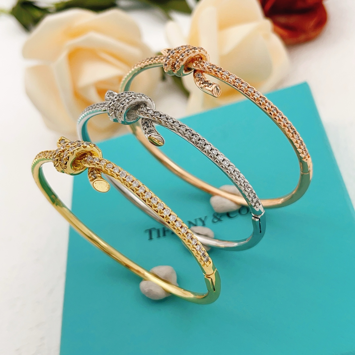 Tiffany Co Tiffany Knot bracelet 18k rose gold with pave set clear diamonds 17cm inner circumference