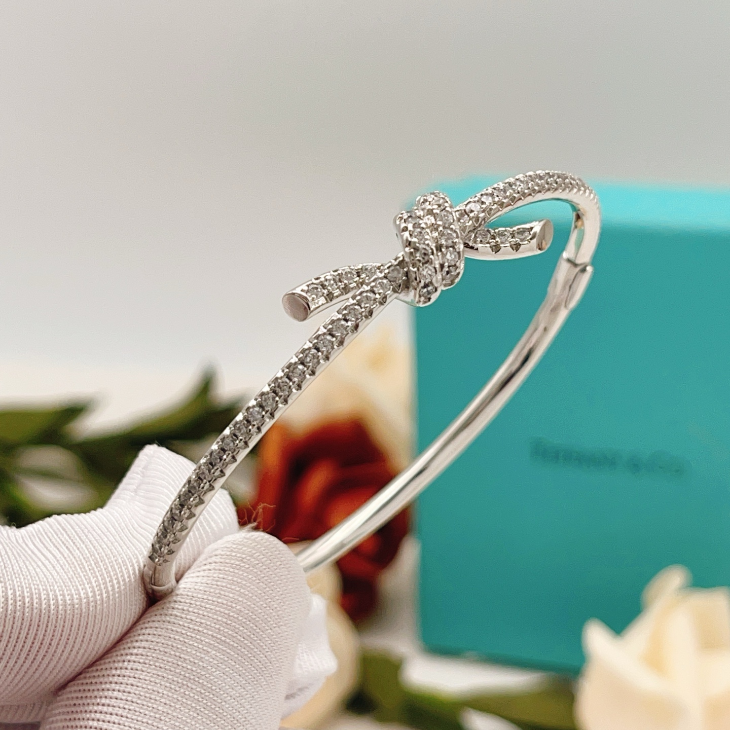 Tiffany Co Knot bracelet silver-toned metal with clear diamond accents 17cm inner circumference