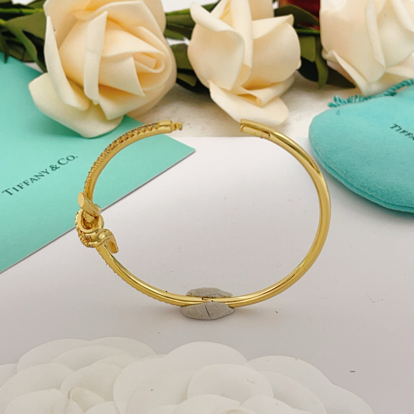 Tiffany Co Knot bracelet yellow gold metal with clear pave diamonds 17cm inner circumference