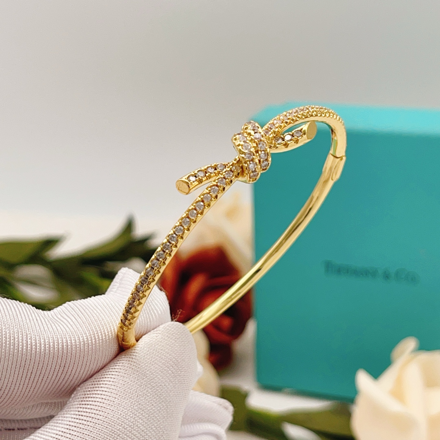 Tiffany Co Knot bracelet yellow gold metal with clear pave diamonds 17cm inner circumference