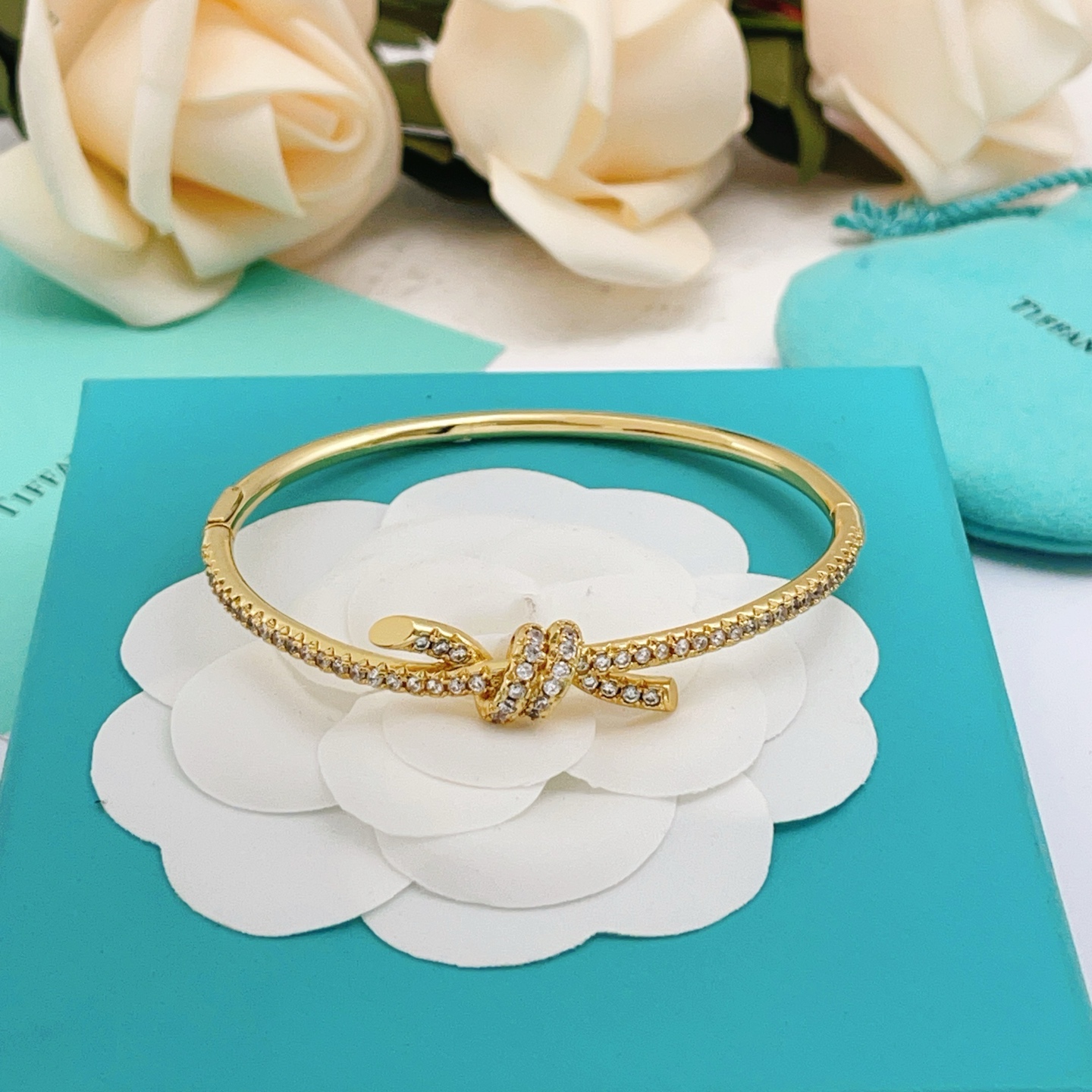 Tiffany Co Knot bracelet yellow gold metal with clear pave diamonds 17cm inner circumference