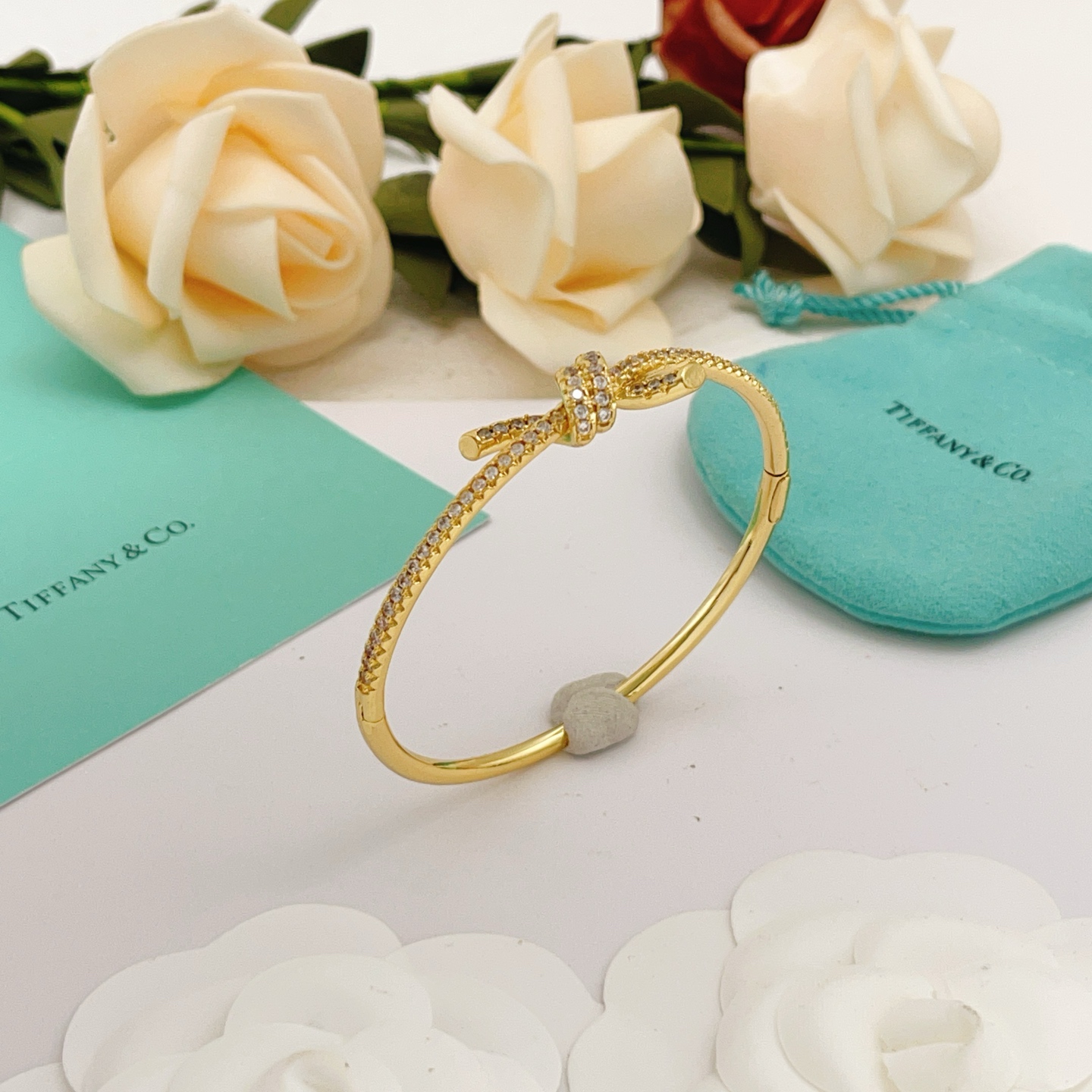 Tiffany Co Knot bracelet yellow gold metal with clear pave diamonds 17cm inner circumference