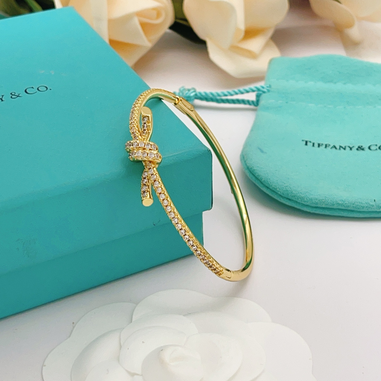 Tiffany Co Knot bracelet yellow gold metal with clear pave diamonds 17cm inner circumference
