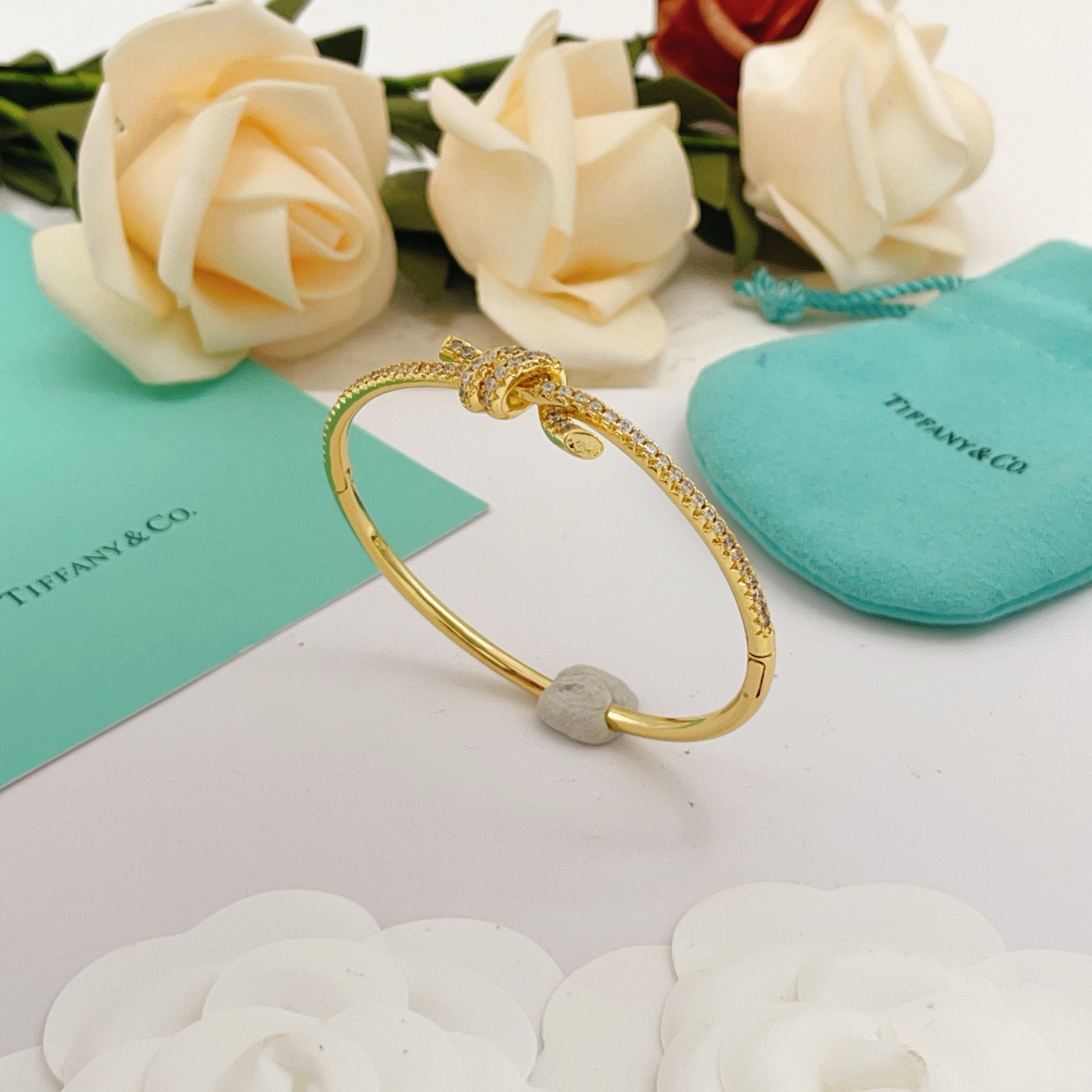 Tiffany Co Knot bracelet yellow gold metal with clear pave diamonds 17cm inner circumference