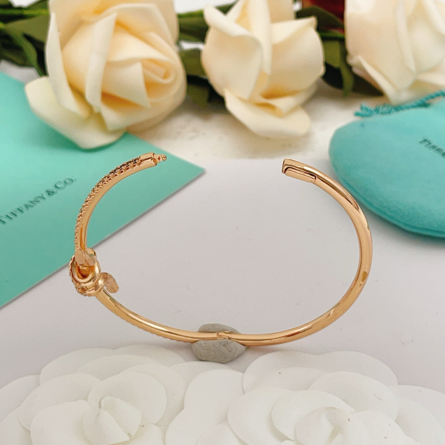 Tiffany Co Tiffany Knot bracelet 18k rose gold with pave set clear diamonds 17cm inner circumference