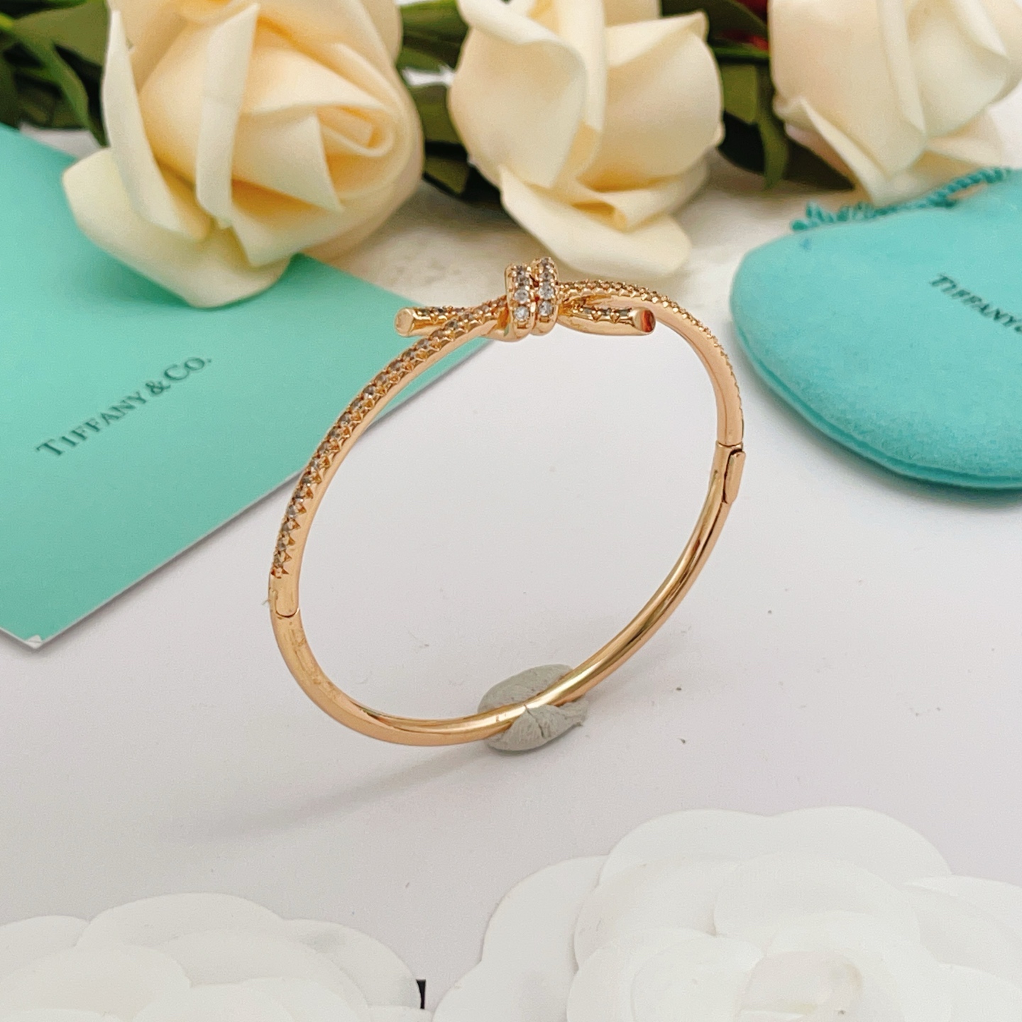 Tiffany Co Tiffany Knot bracelet 18k rose gold with pave set clear diamonds 17cm inner circumference